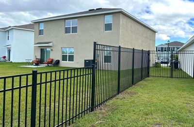 Aluminum Fence Installation using Black 3 Rail Aluminum Fence
