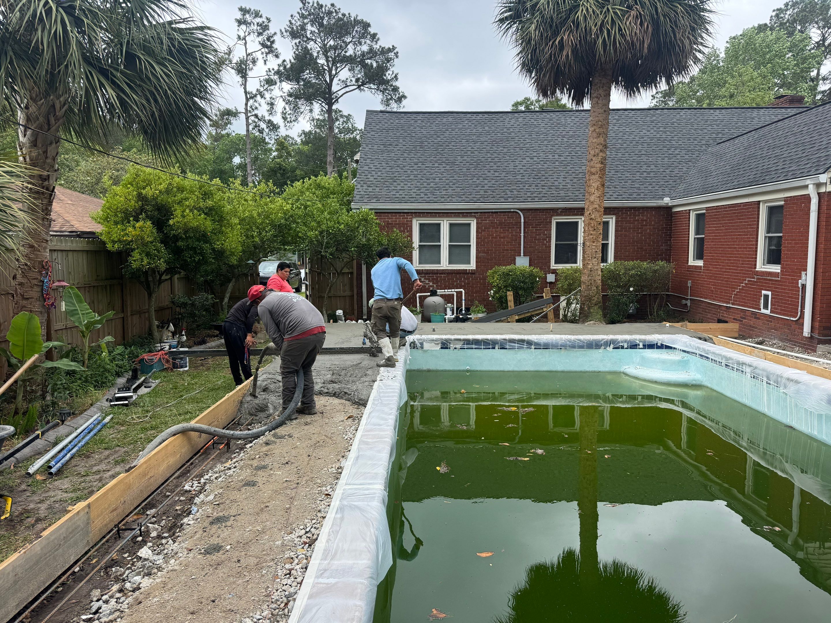 Savannah Pool Deck Replacement with Textured Concrete and Brick Coping by Lowcountry Scapes, LLC