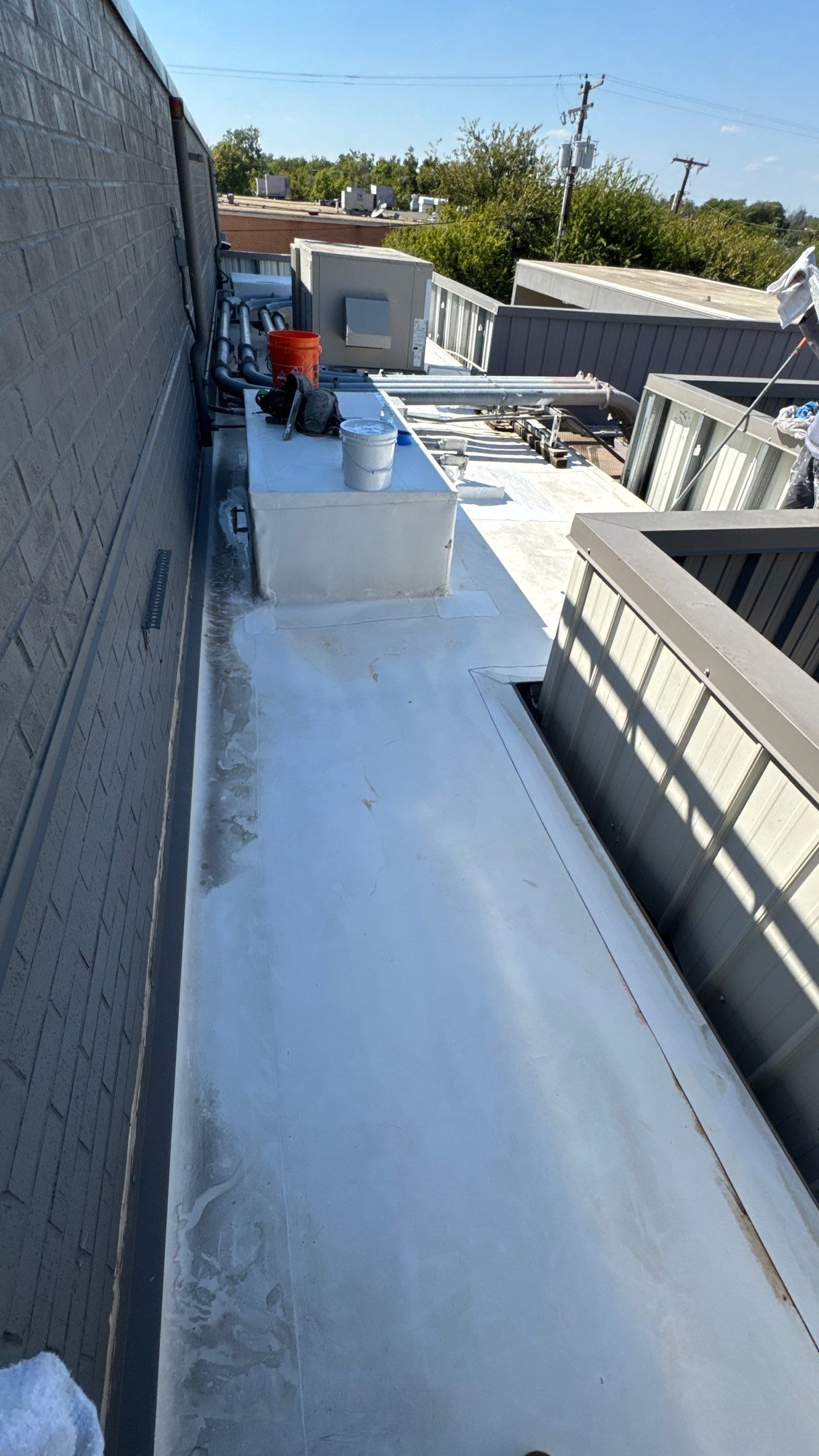 Commercial Roofing Repair using TRP #924 Eterna-Sil Premium Silicone Roof Coating by Harvey Roofing & Construction
