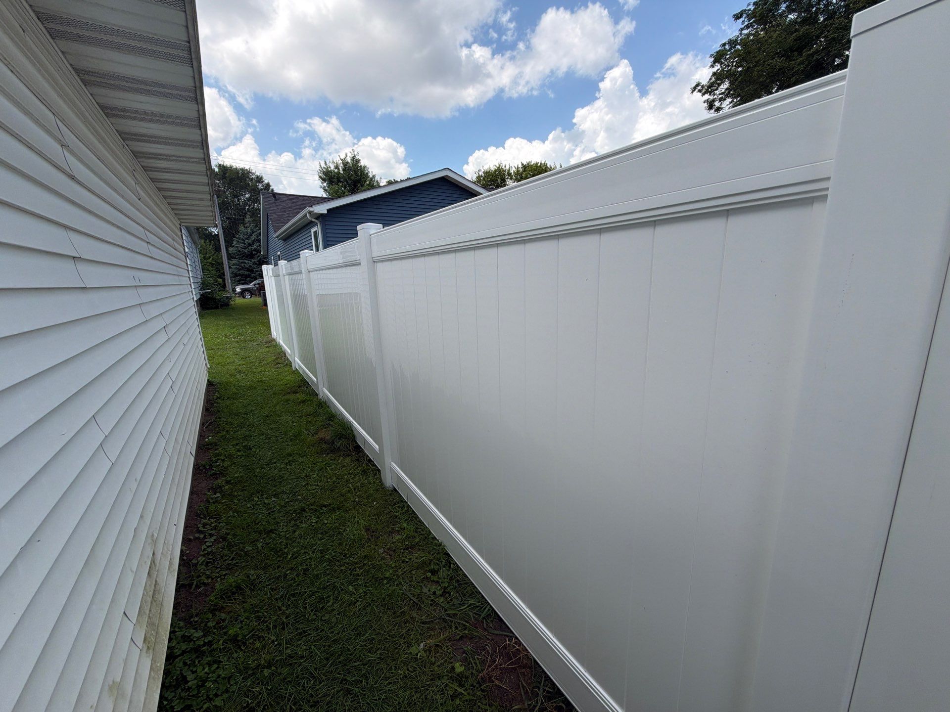 White Vinyl Privacy Fence Installation in Waterloo, Iowa by Perfect Picket Fence and Stain