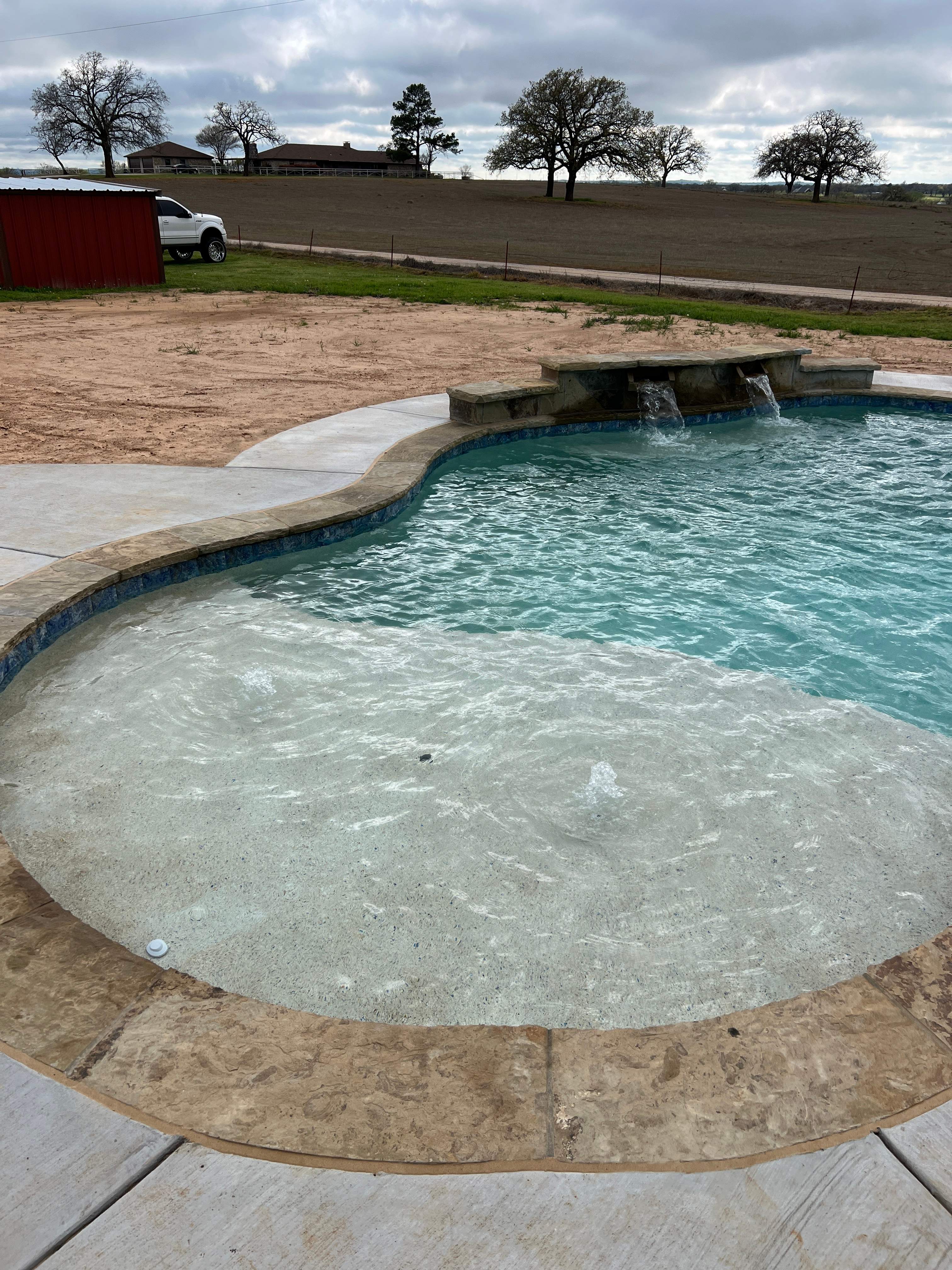 Freeform Pool with Raised Spa and Spillway by Pinnacle Pools and Spas - DFW