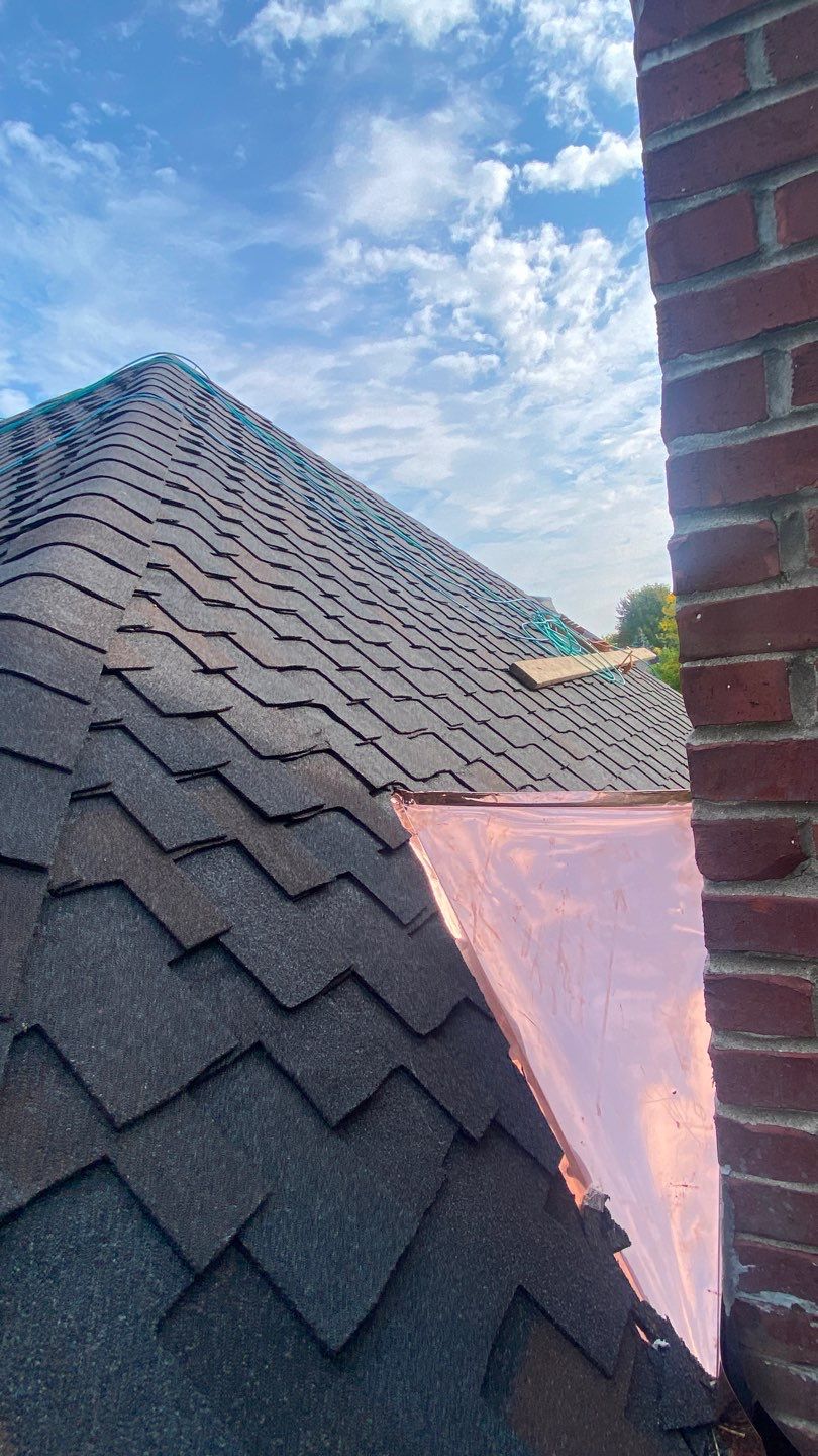 Asphalt Roof Replacement by Custom Installations