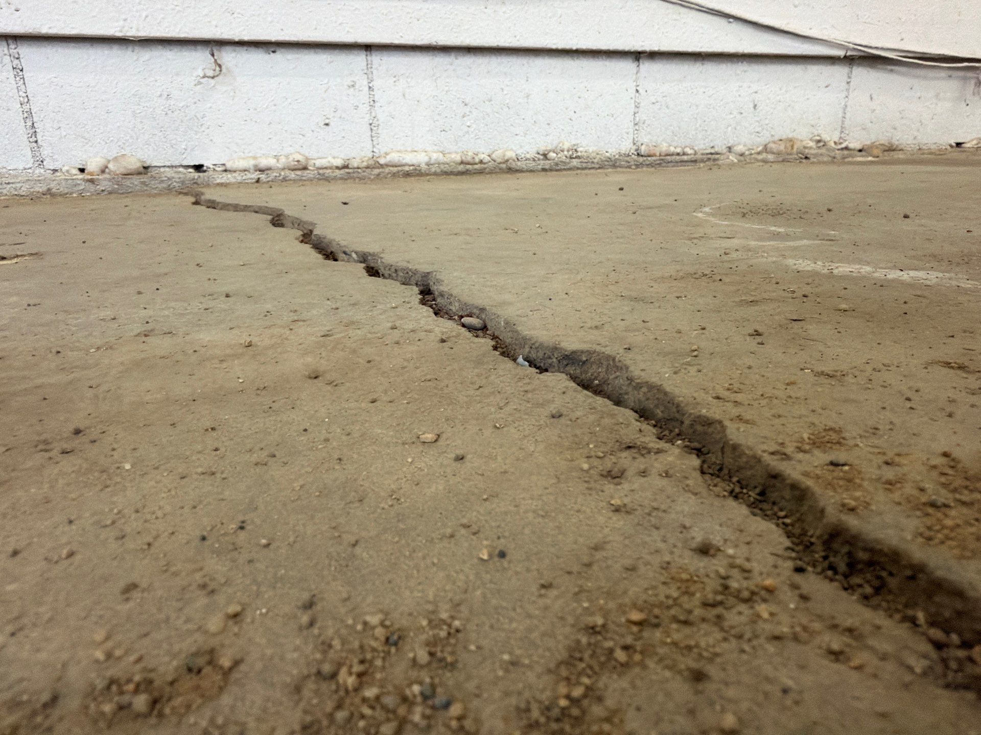 Feather Grey Garage Floor Coating and Crack Repair in Beresford by Select Painting, Coatings & Garage Cabinets