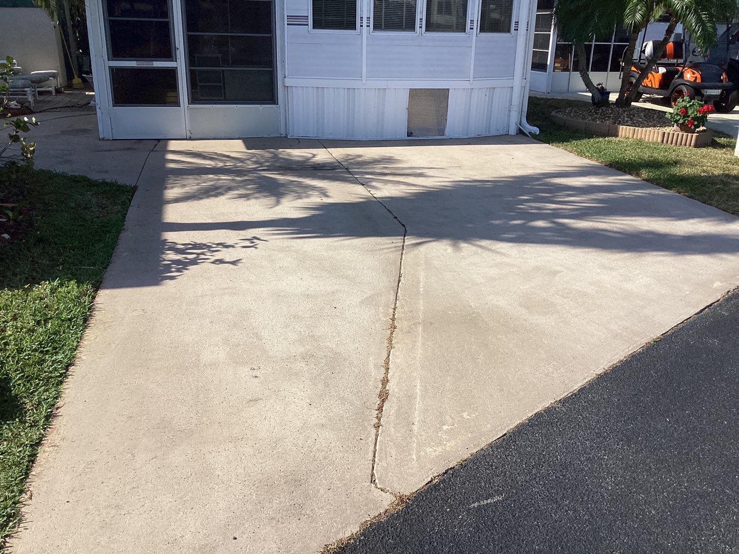 Driveway using Pebble Beach by Amvet concrete coatings llc