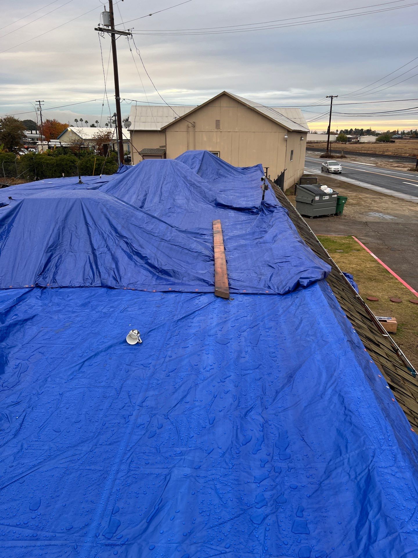 Emergency Roof Tarp Service - Fresno, CA by Grandmark Service Company