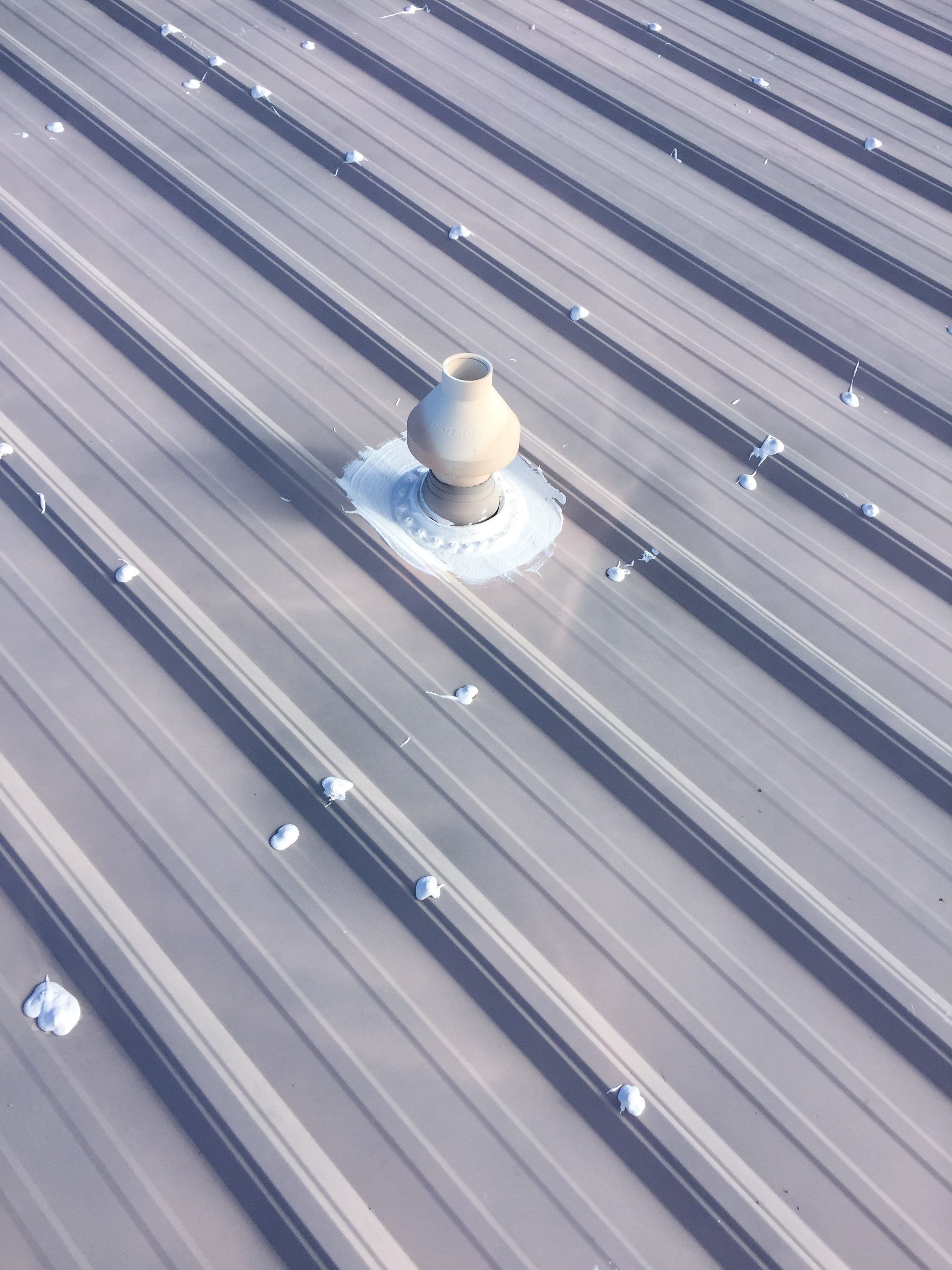 Commercial Roof Coating using Gaco Silicone Roof Coating by Secure Construction Company Inc