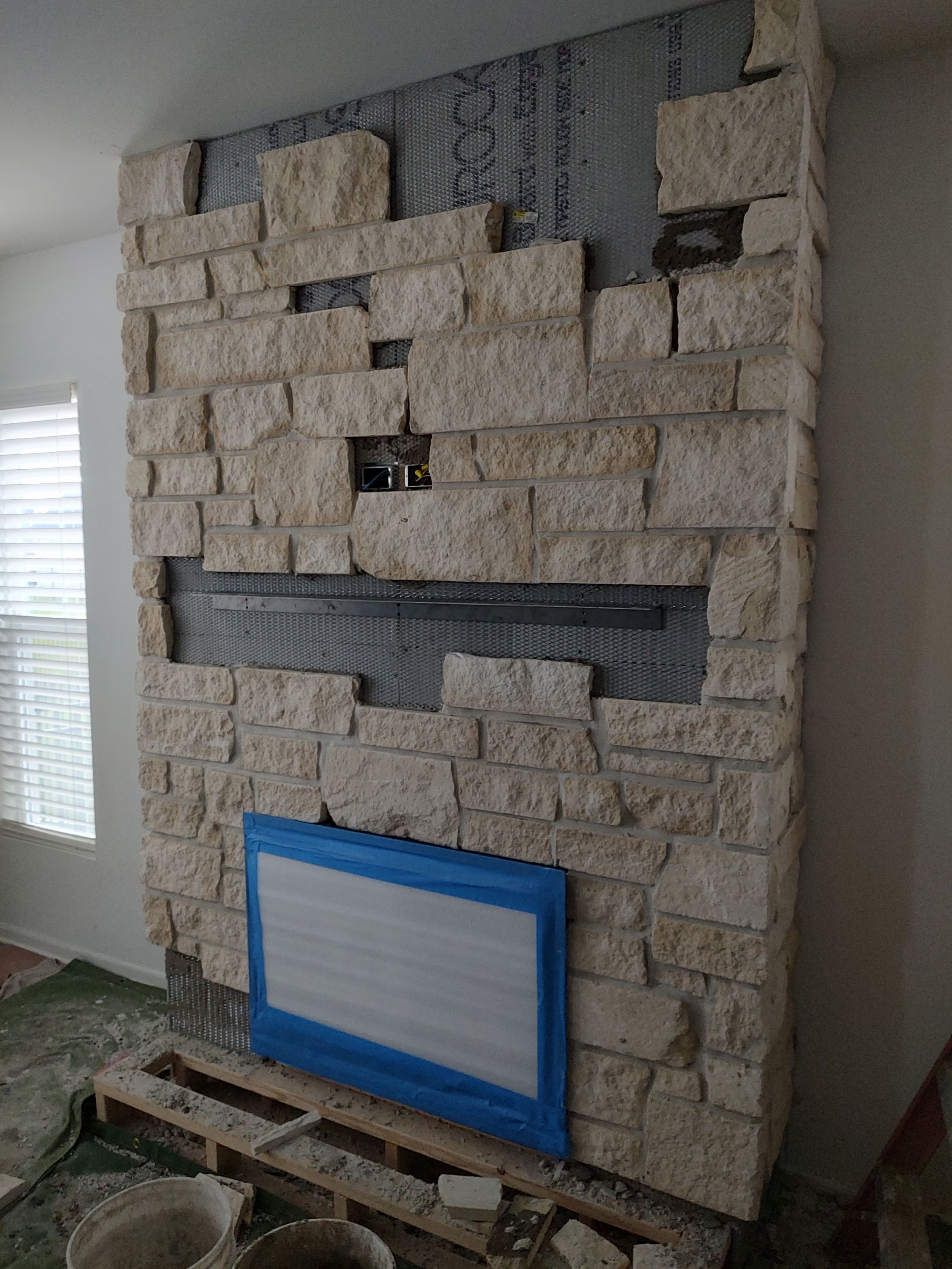Electric Fireplace & Stone Veneer Installation by Leonard and Sons Building Services, Inc.