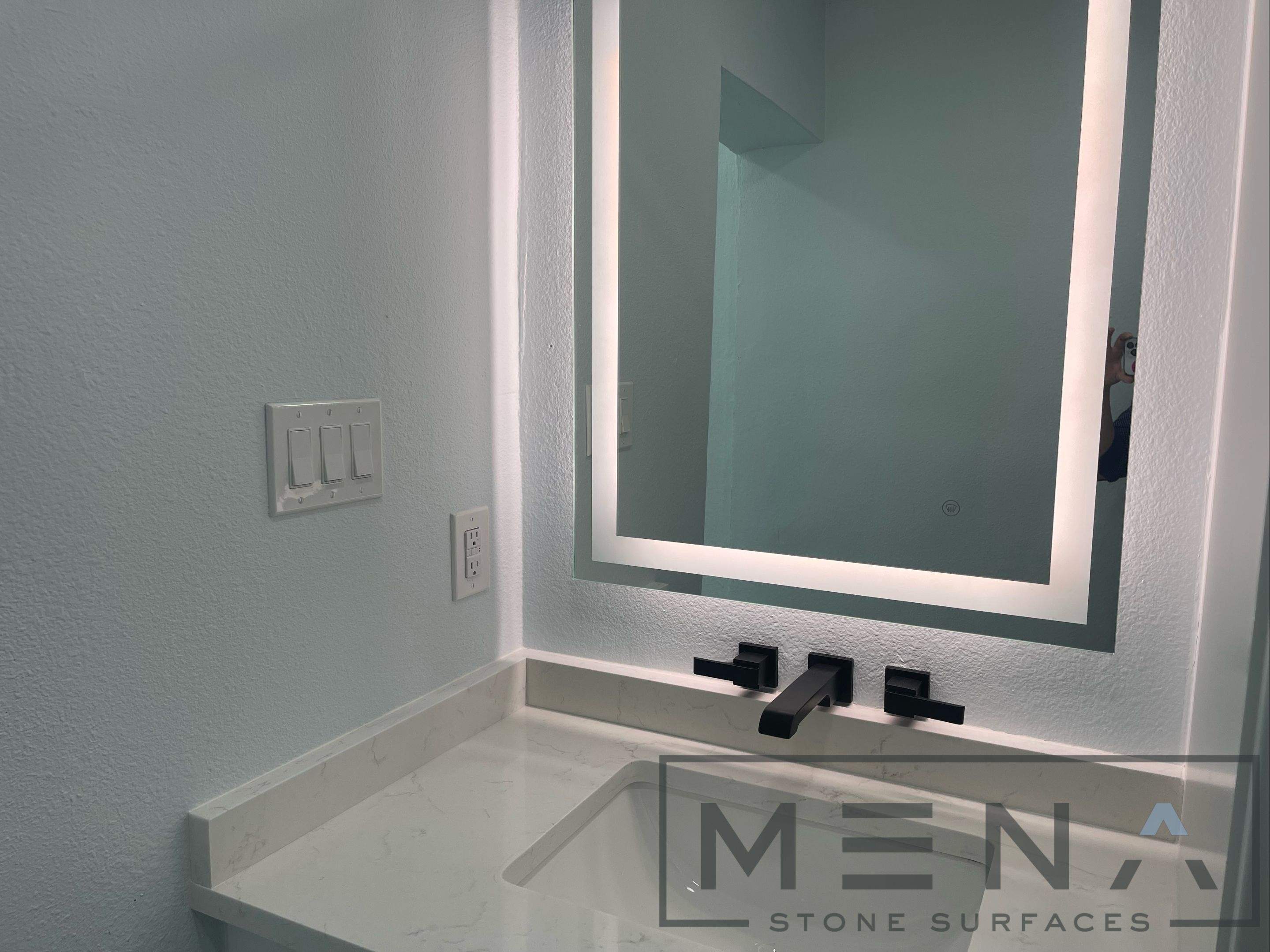 Complete Bathroom Remodel Featuring Marble Tile and Teal Herringbone Niche by Mena stone surfaces