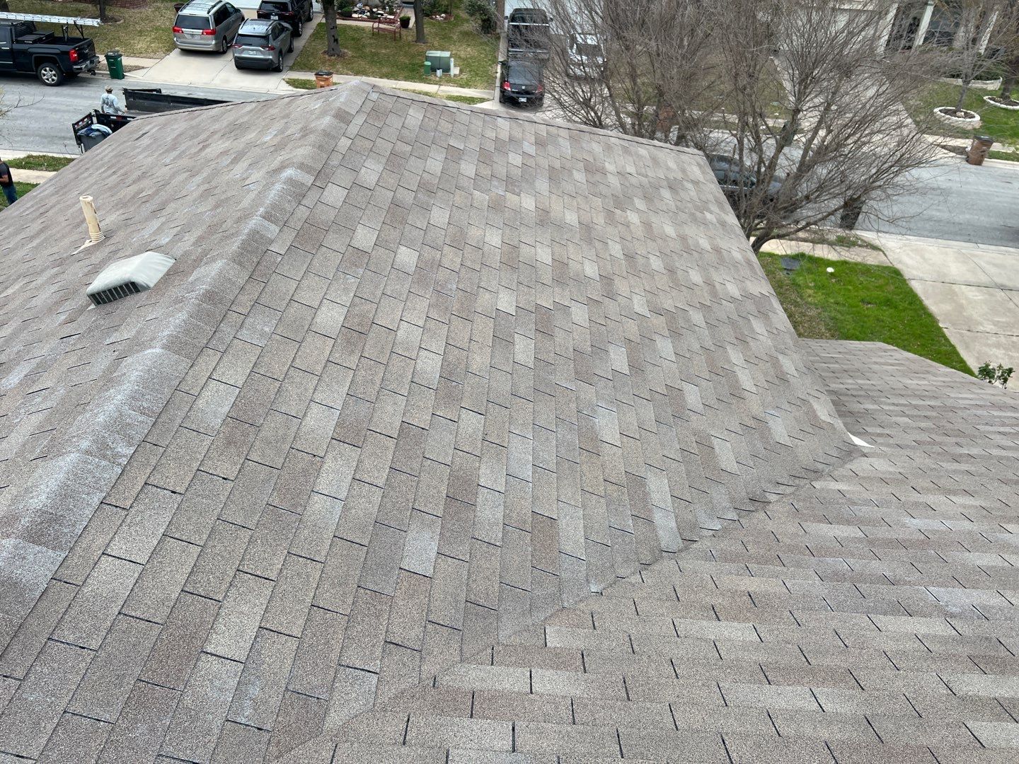 Wind damaged roof replacement by Oakwood Roofing and Construction, LLC