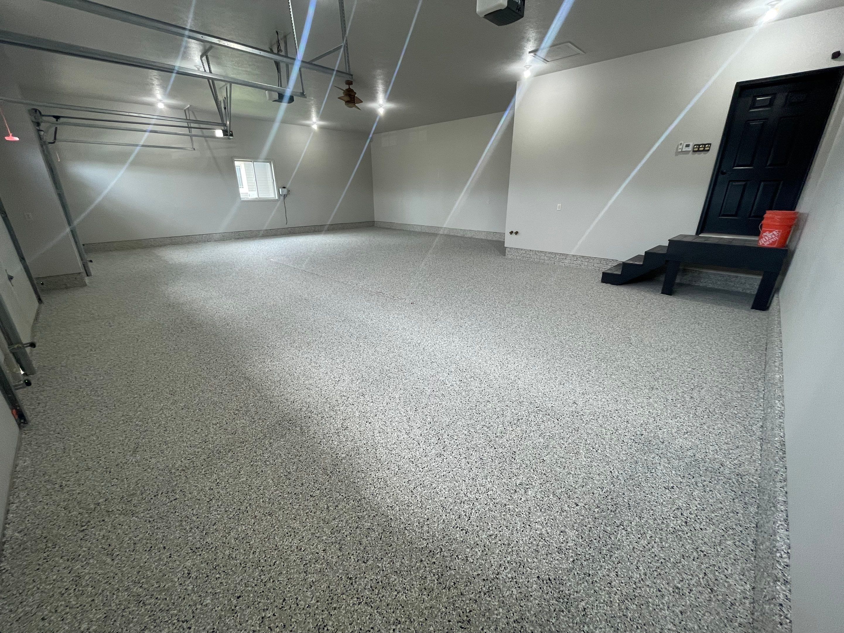 Multi-Car Garage Epoxy Floor Coating in Beresford by Select Painting, Coatings & Garage Cabinets