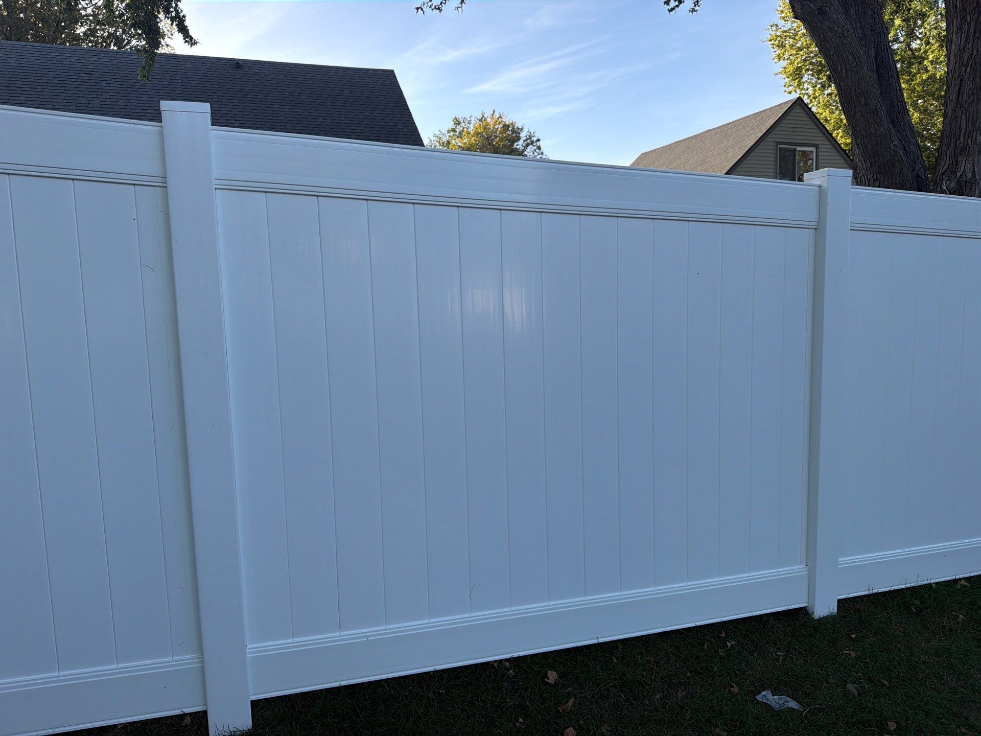 White Vinyl Privacy Fence and Gate Installation in Grundy Center by Perfect Picket Fence and Stain