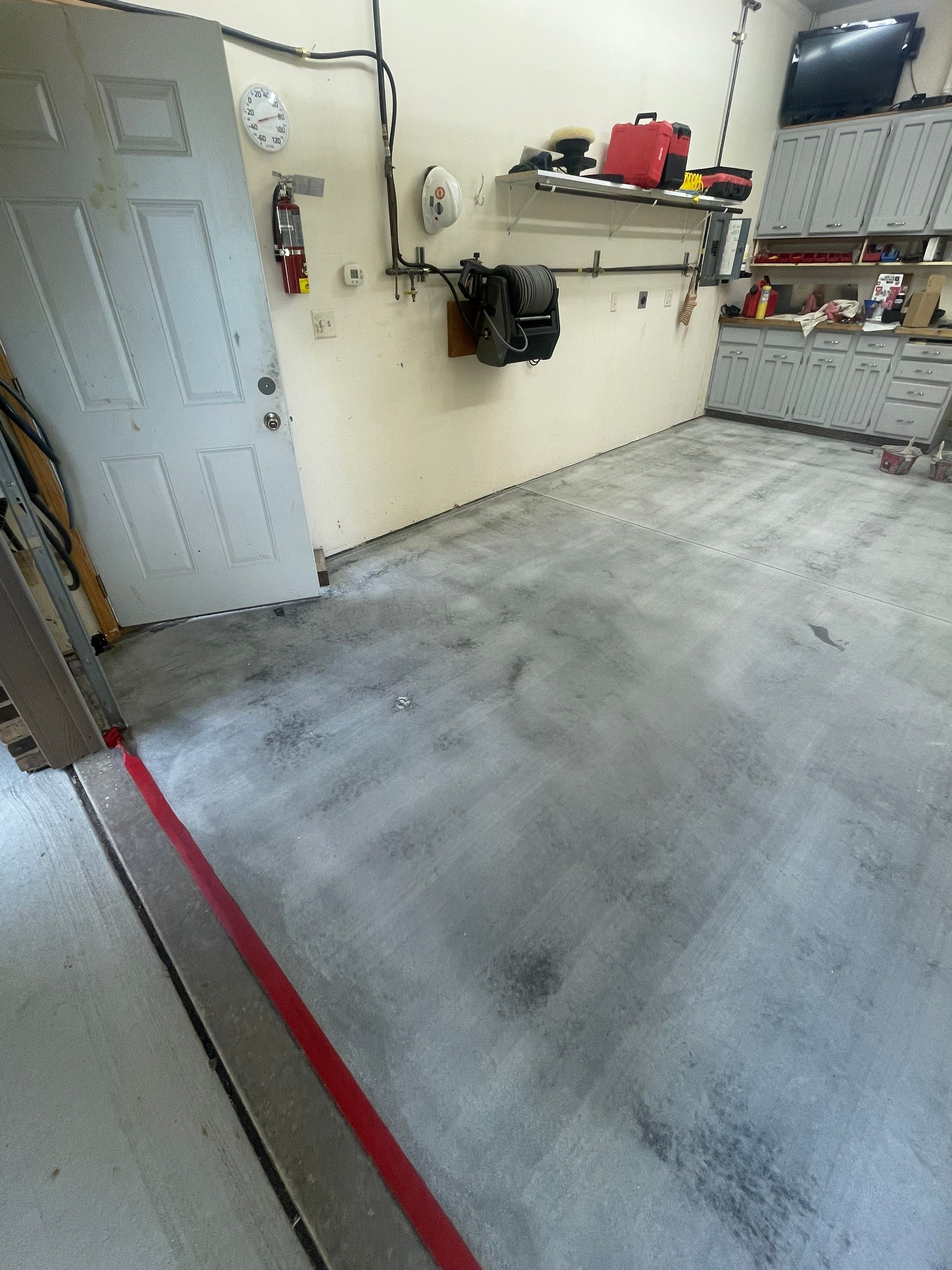 Multi-Stall Garage Floor Coating Installation in Sioux Falls by Select Painting, Coatings & Garage Cabinets