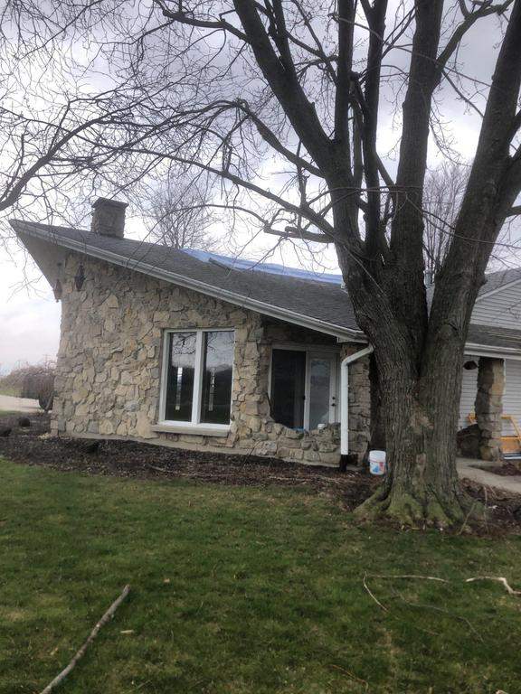 Storm damage roof replacement by Nitro Roofing and Construction