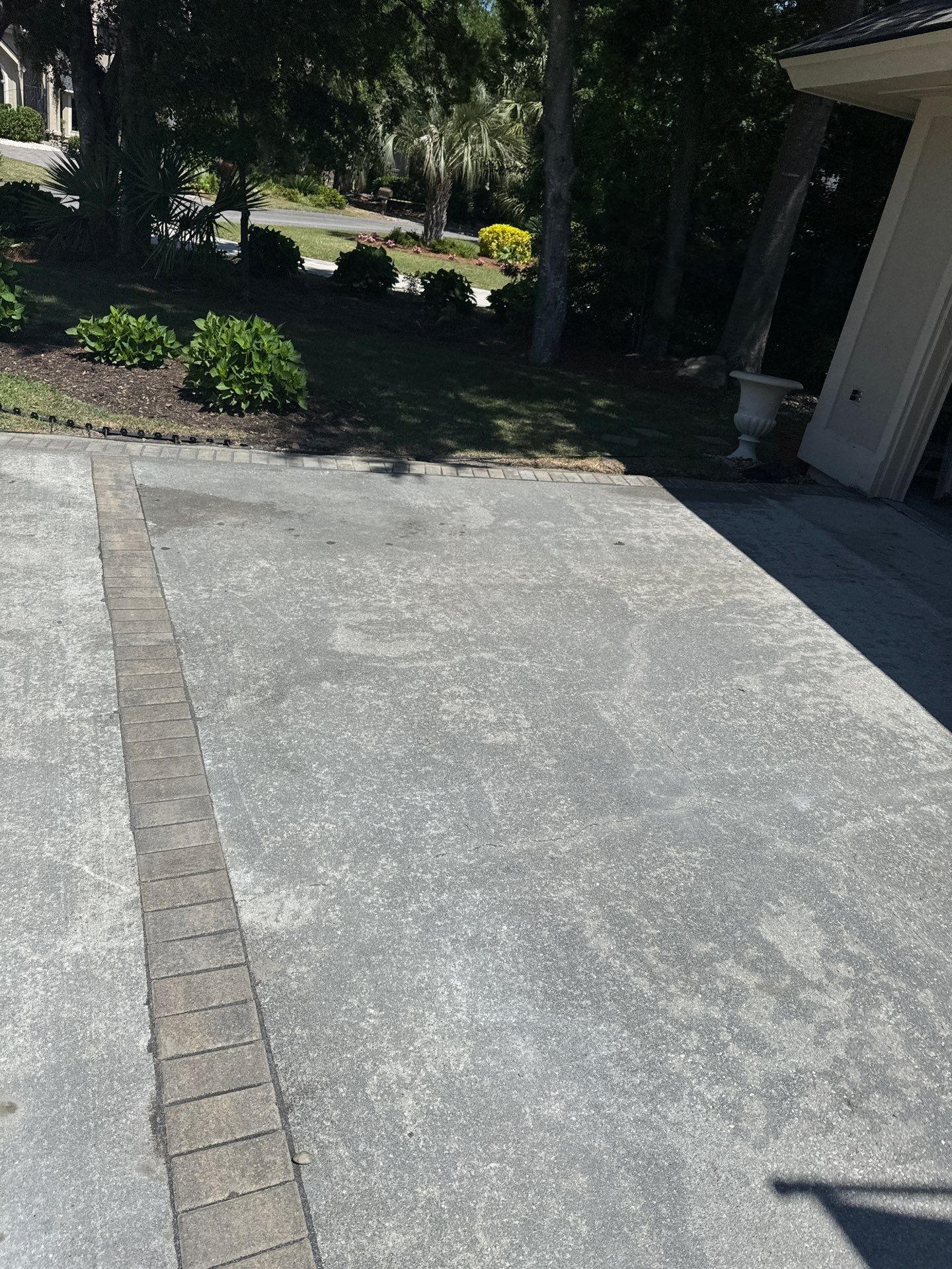 Concrete Driveway Repair with Decorative Paver Accents in Hilton Head Island by Lowcountry Scapes, LLC