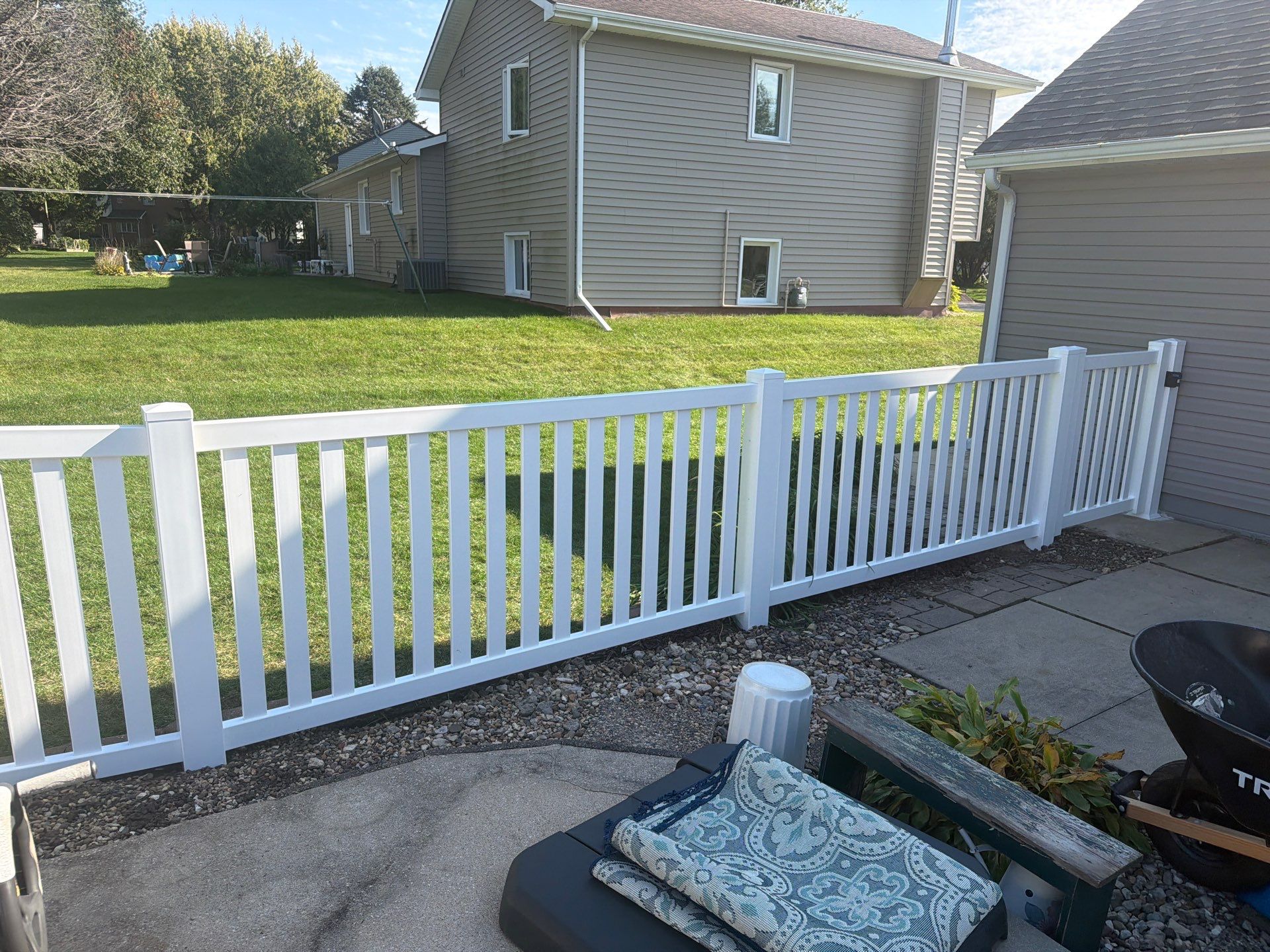 White Vinyl Picket Pool Fence Installation in Waterloo, Iowa by Perfect Picket Fence and Stain