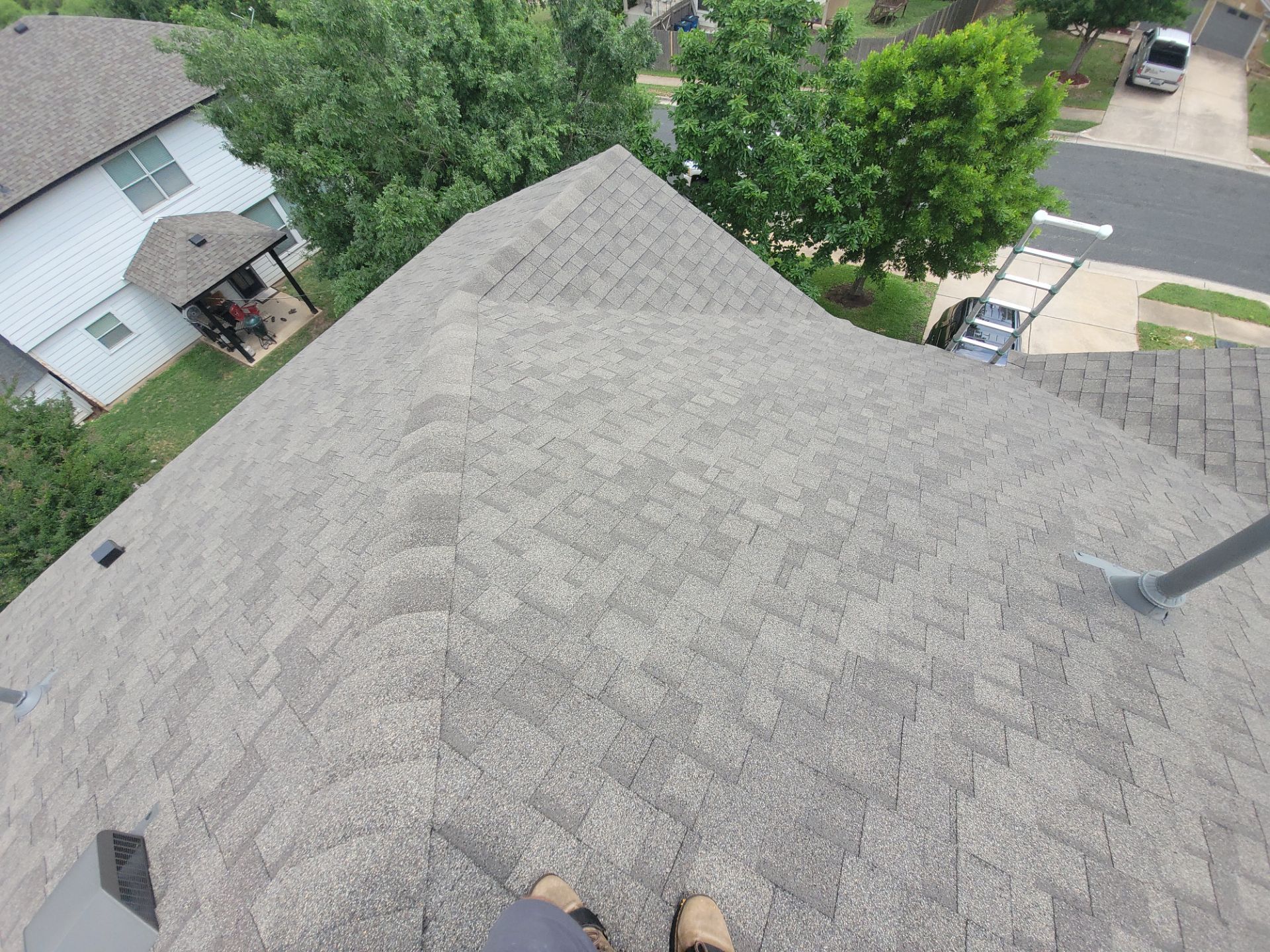 Residential Roofing Installation using IKO, Cambridge and gutters by Oakwood Roofing and Construction, LLC