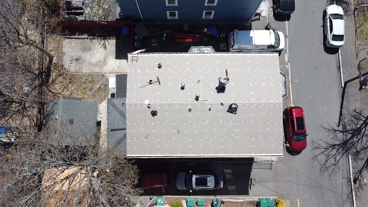 Residential Rubber Roofing -2 Story Home  by Delarosa Construction & Design