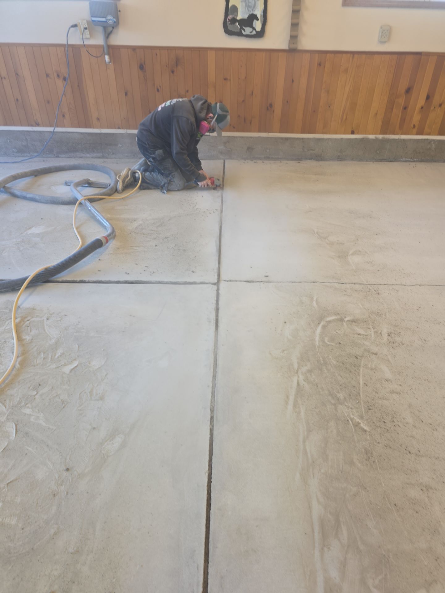 Sandstone Polyaspartic Garage Floor Coating Transformation in Davenport by Croc Coatings, LLC
