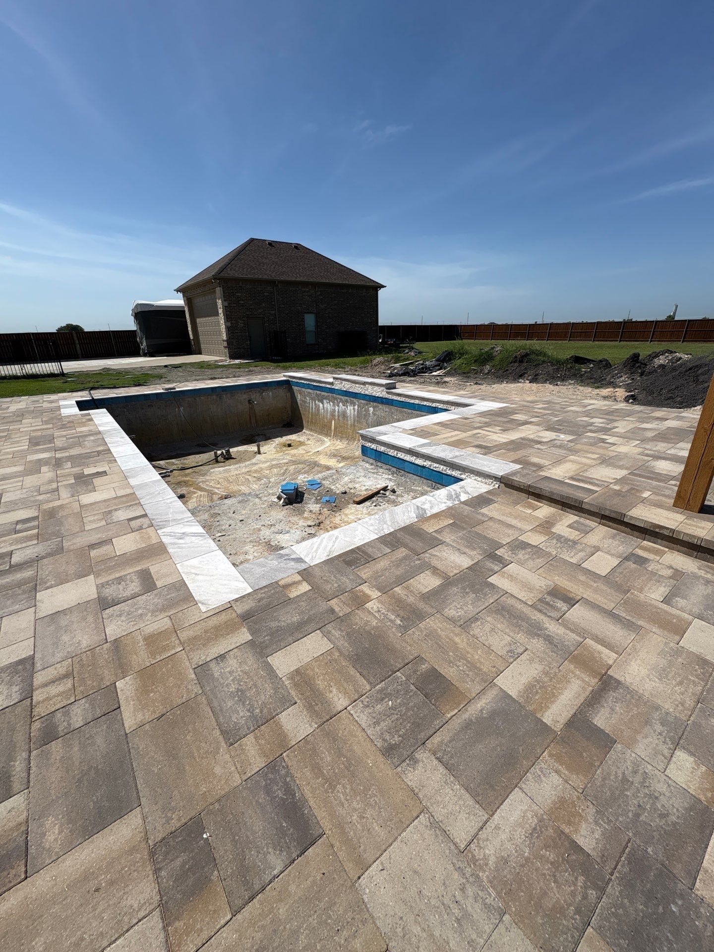 Modern Geometric Pool with Tanning Ledge by Pinnacle Pools and Spas - DFW
