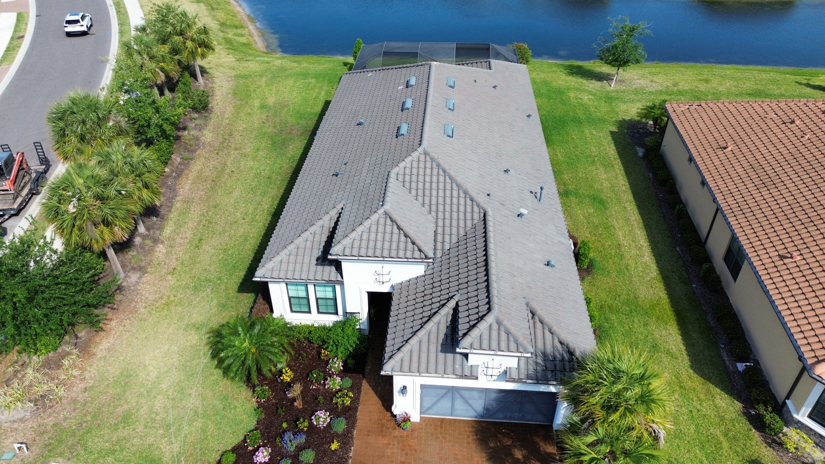 Barrel Tile Roof Cleaning in Artisan Lakes, Palmetto, FL | No Roof Walking on Roof by Sunshine AquaWash