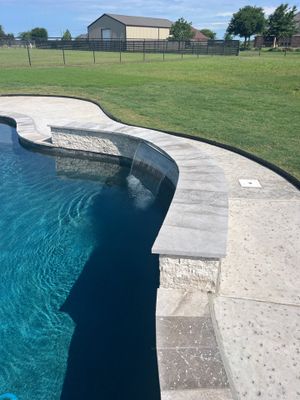 Freeform Pool with Raised Stone Spa Wall