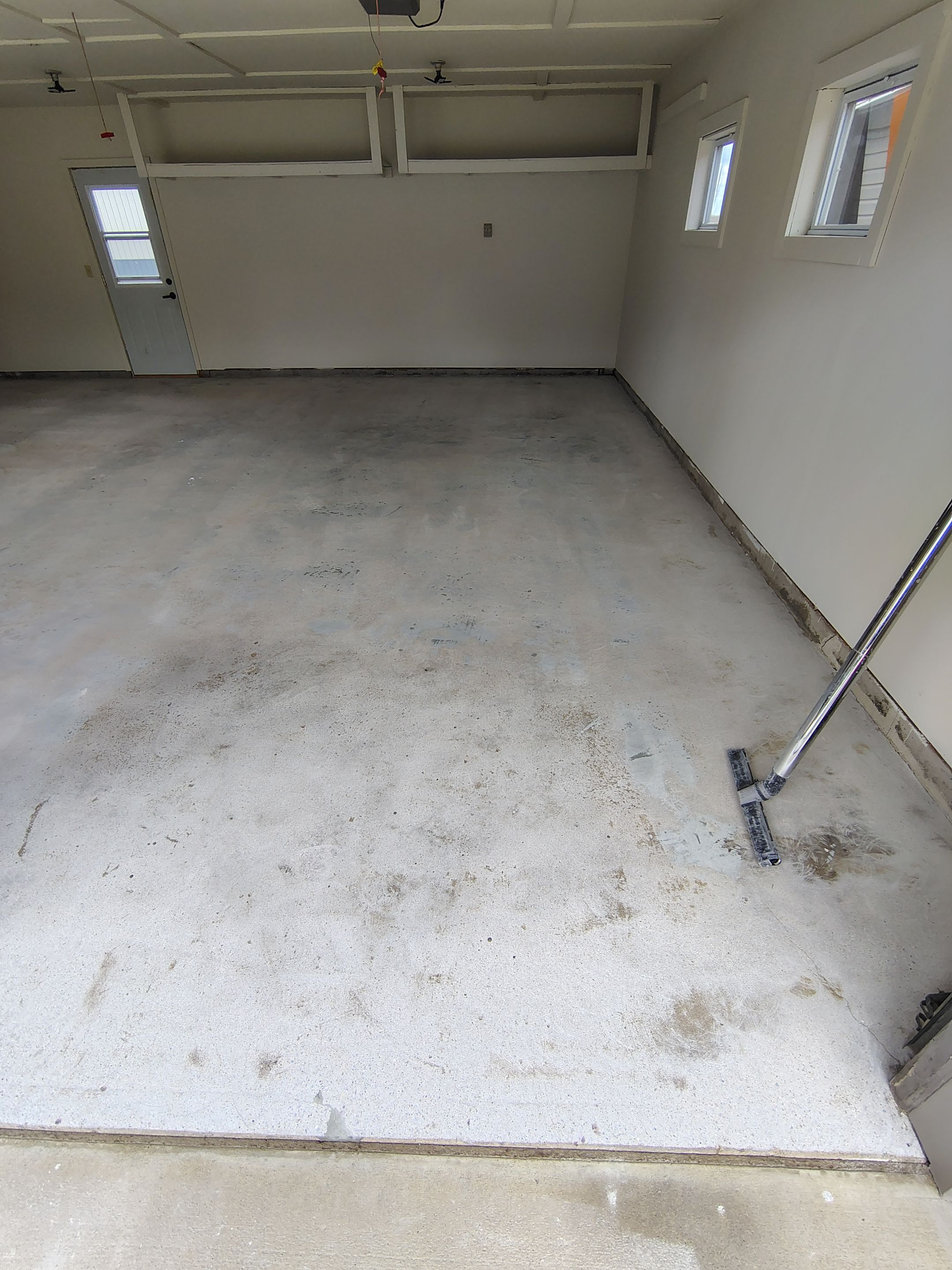 Full-Flake Epoxy Garage Floor Coating Installation in Sioux Falls by Select Painting, Coatings & Garage Cabinets