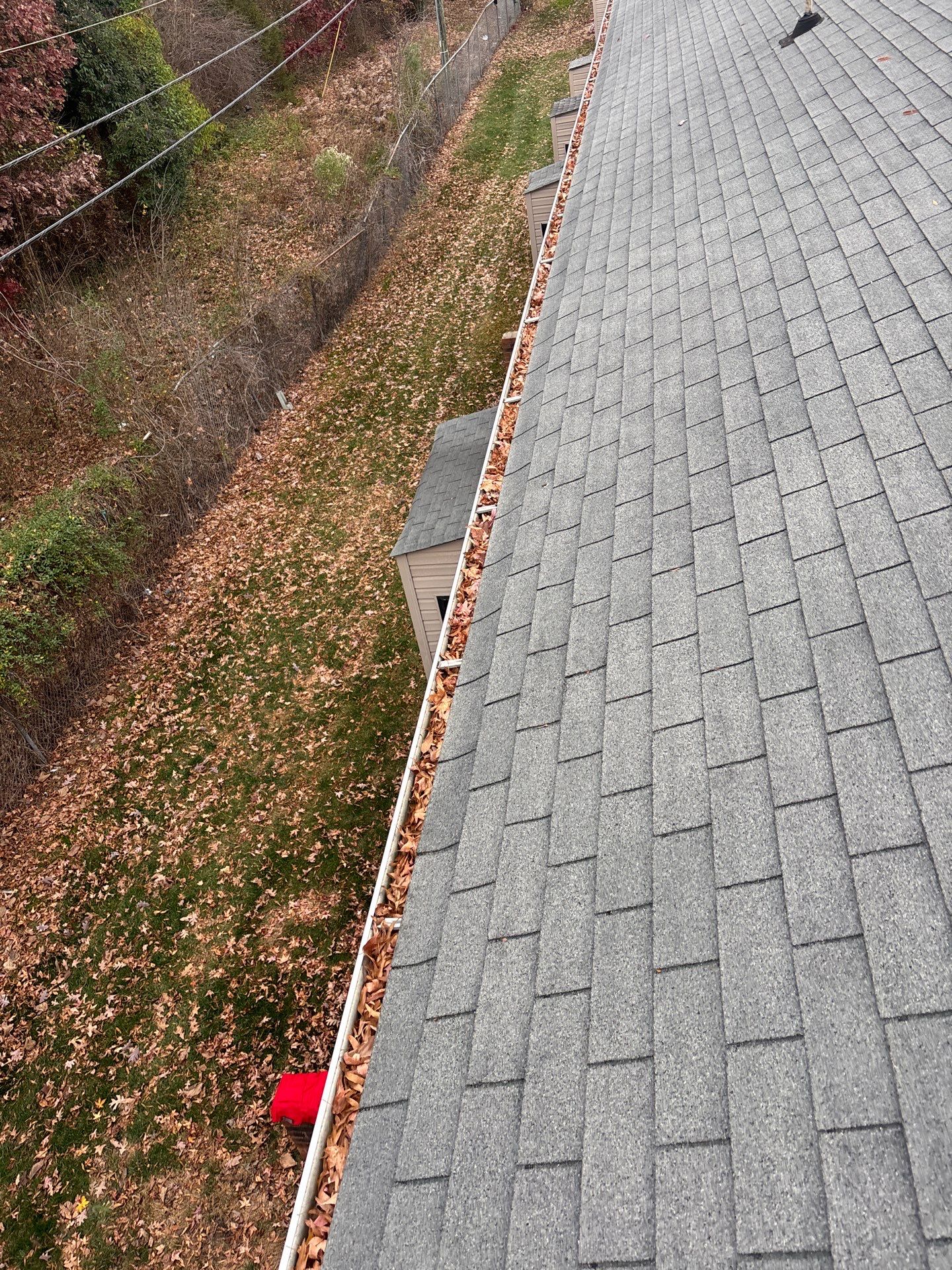 Commercial gutter cleaning Indian Trail & Matthews, NC before photo with filled gutters