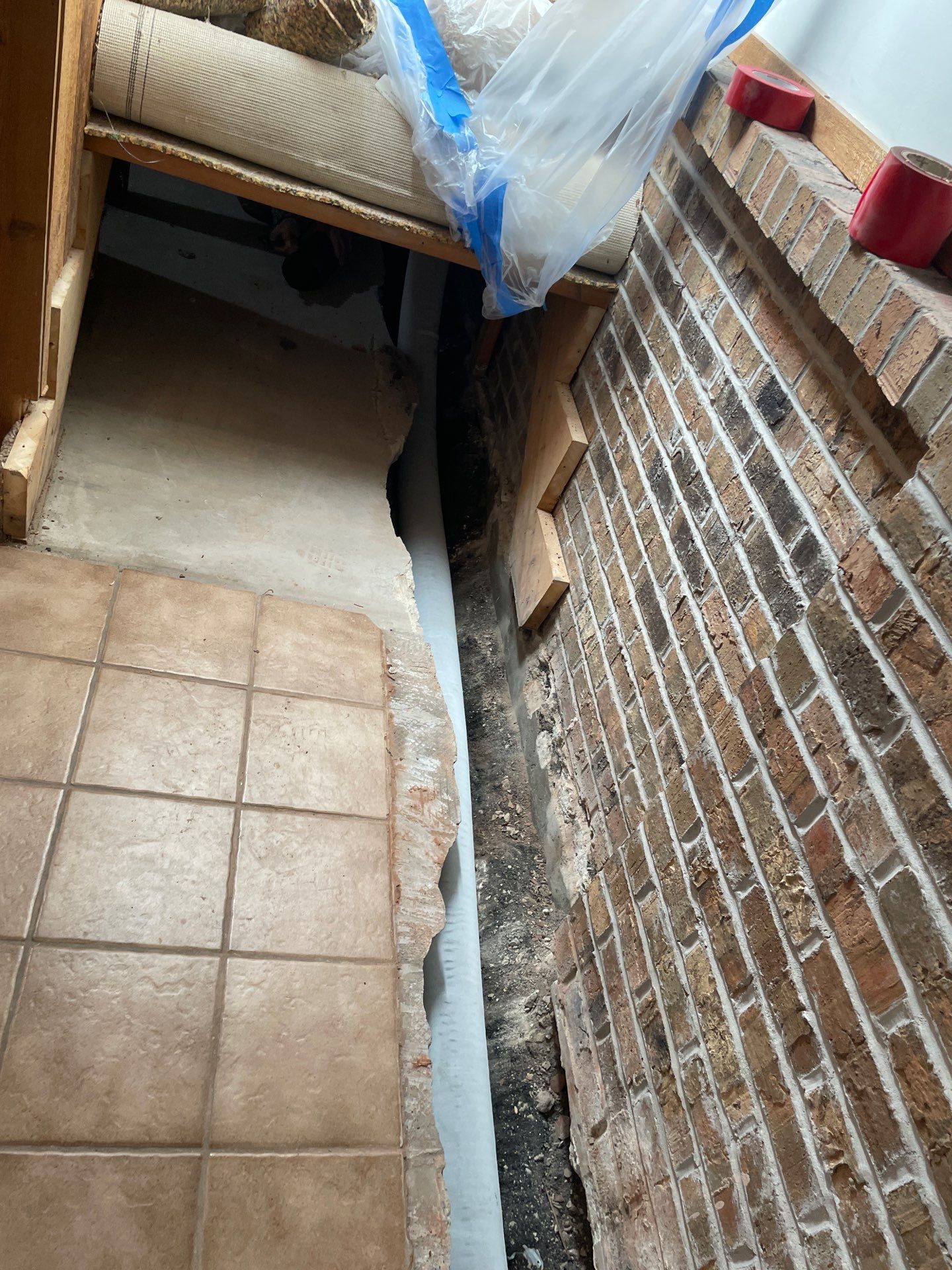 Interior Drain Tile System in Elwood by Area Wide Waterproofing