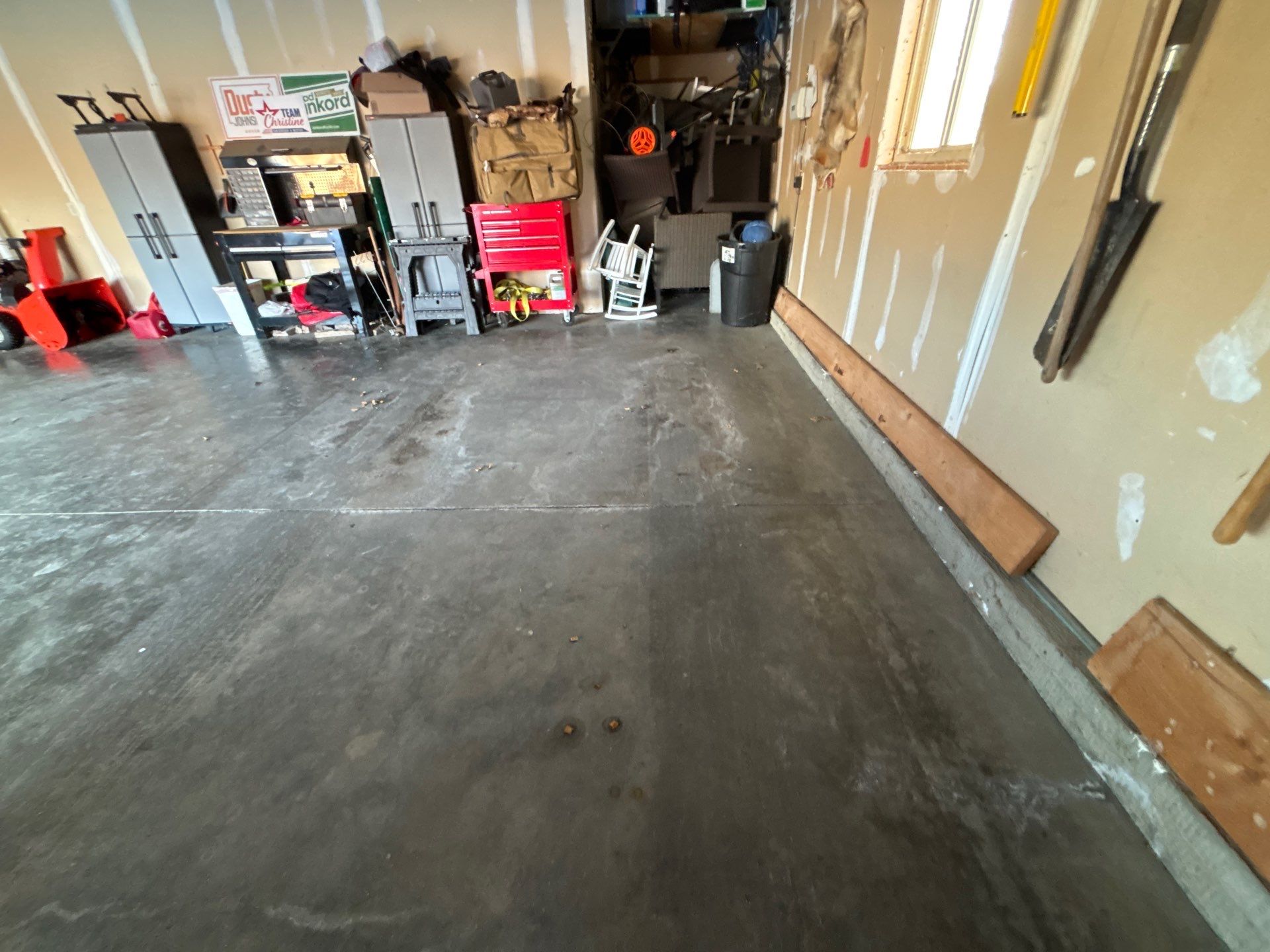 Custom Grey Speckled Epoxy Floor Coating for Sioux Falls Garage by Select Painting, Coatings & Garage Cabinets