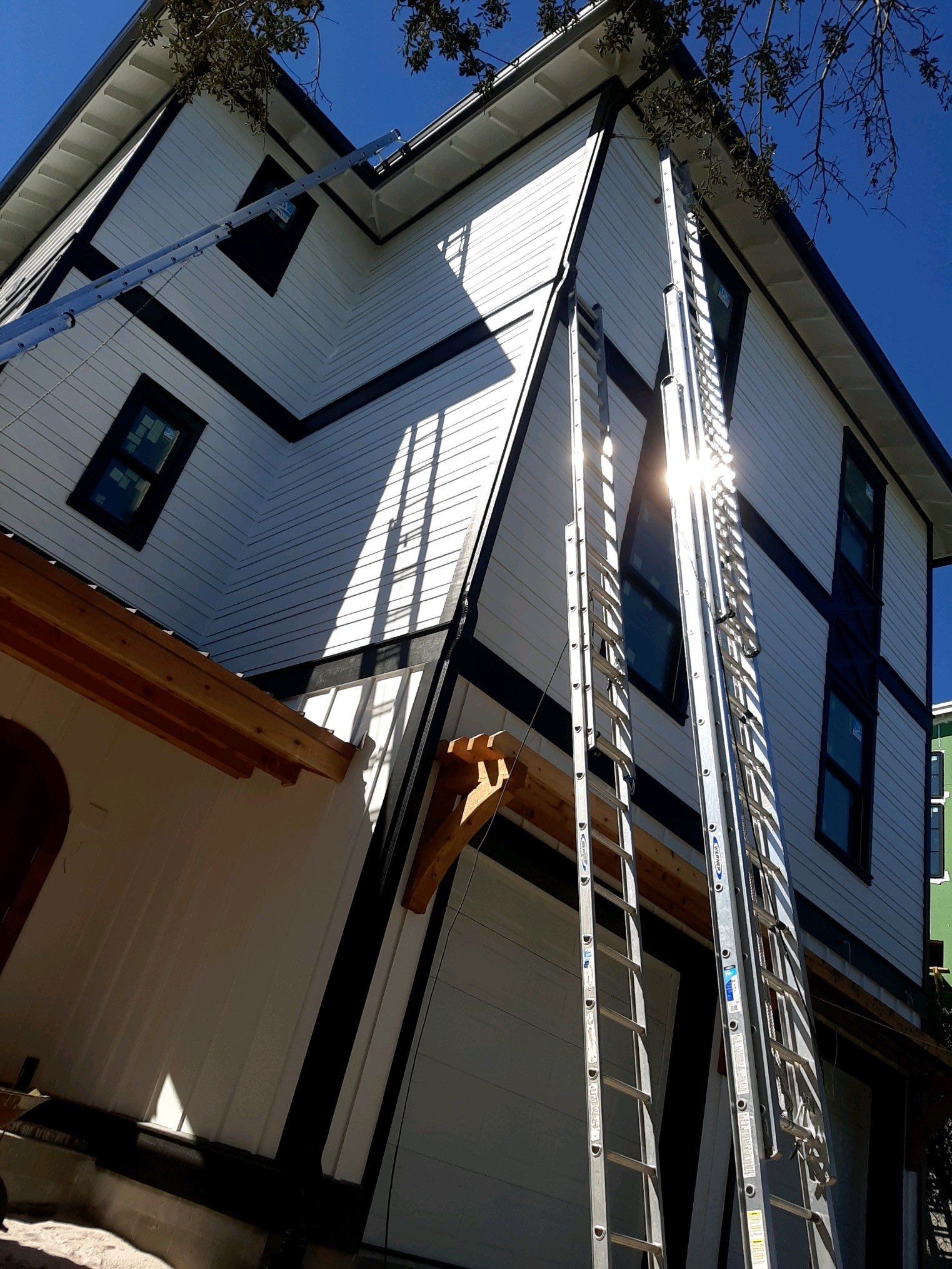 Seamless Gutter Installation Using Black Half Round Seamless Gutters by Gutter Professors
