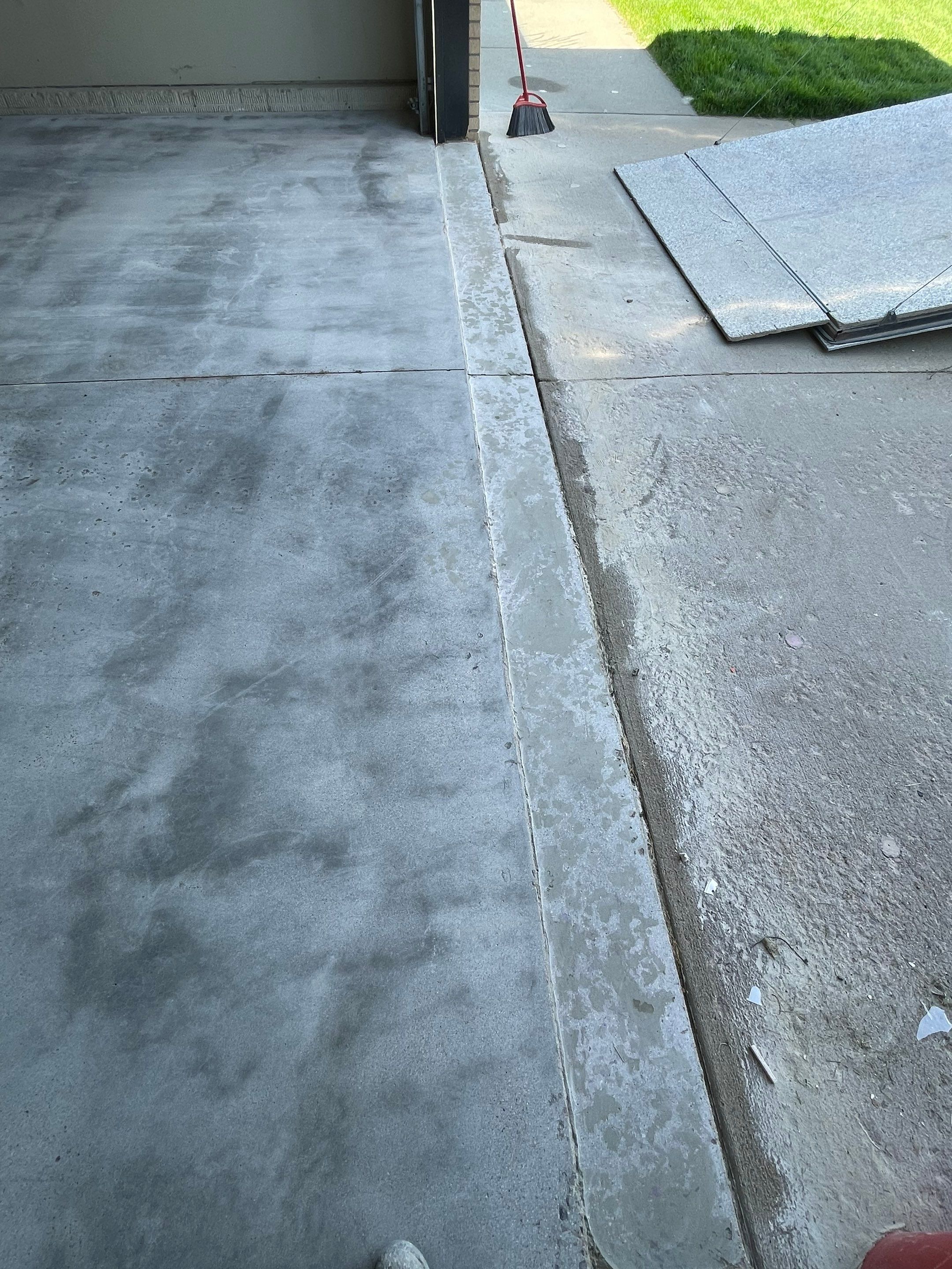 Cabin FEver Flake Garage Floor Coating Installation in Sioux Falls by Select Painting, Coatings & Garage Cabinets