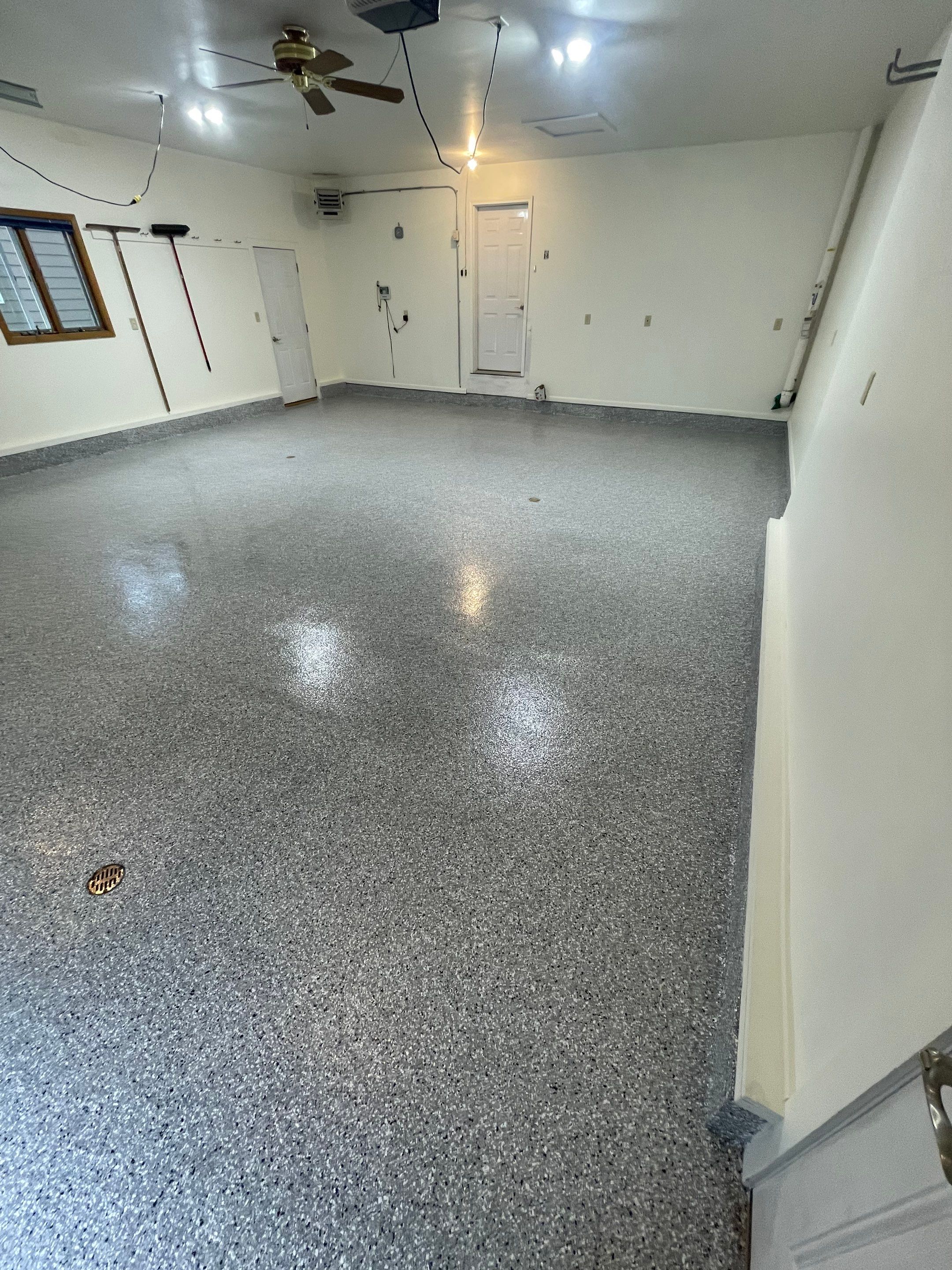 Madison Garage Concrete Coating with Feather Grey Speckle Finish by Select Painting, Coatings & Garage Cabinets