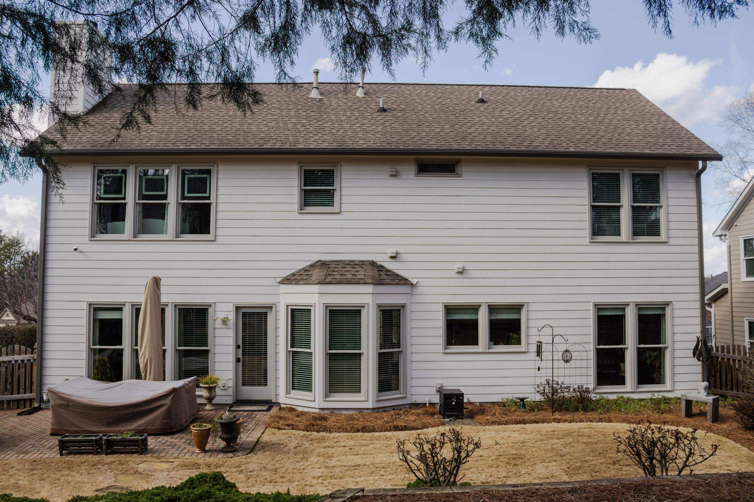 Exterior Painting, James Hardie Siding Install, and Gutter Replacement in Alpharetta, GA - After Results Taken Six Years After Painted by Nelson Exteriors 