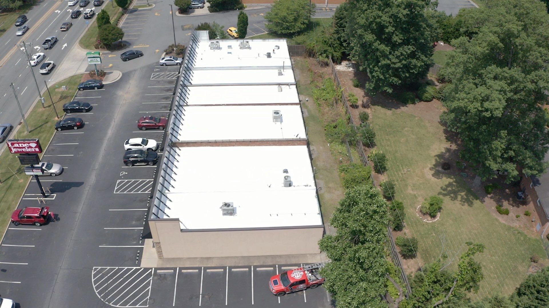 Commercial Roof Coating using Fiberseal basecoat and Silicon Topcoat by Just In Time Roofing and Restoration