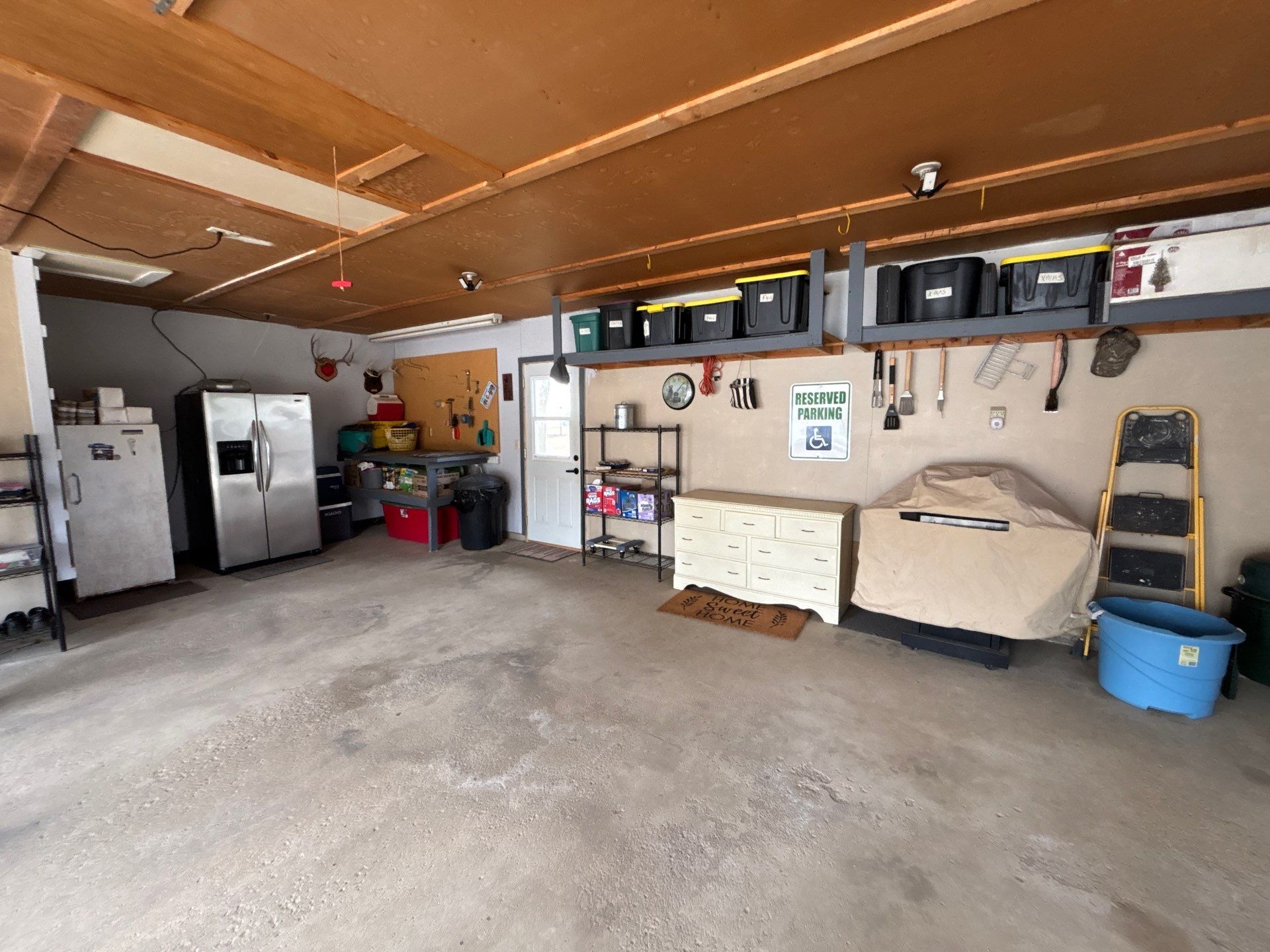 Full-Flake Epoxy Garage Floor Coating Installation in Sioux Falls by Select Painting, Coatings & Garage Cabinets