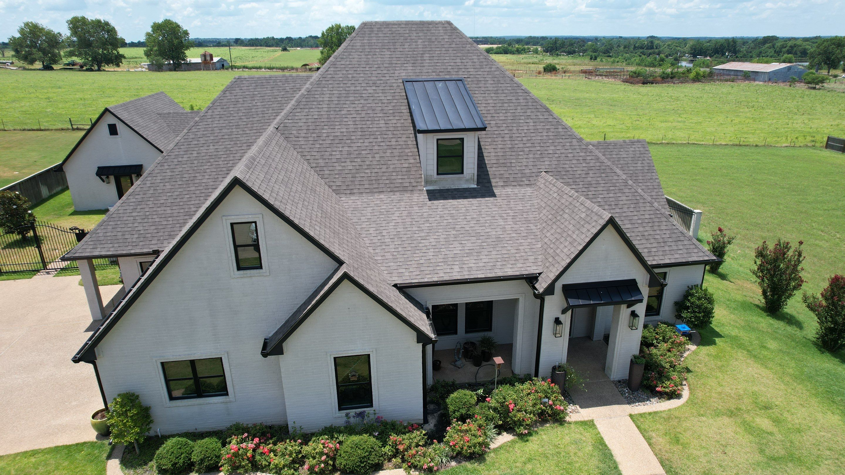 Architectural Shingle and Standing Seam Metal Roof Installation in Mount Selman by Sky High Roofing