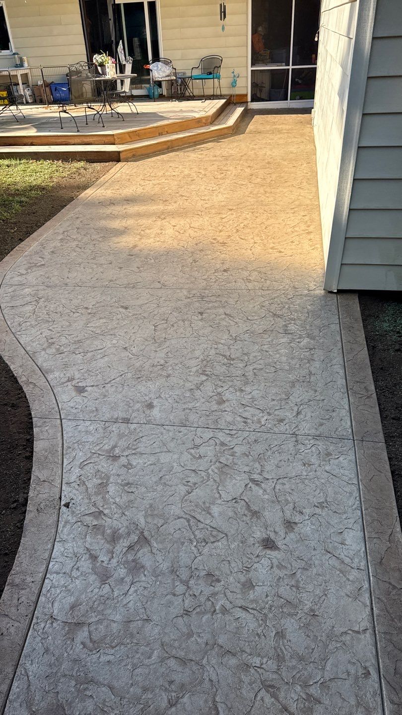 Oxford slate stamped patio  by NG Masonry & Construction LLC