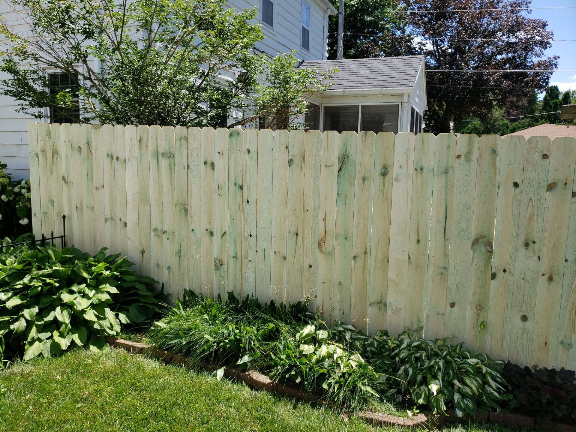 Pressure-Treated Pine Privacy Fence Replacement in Waterloo, Iowa by Perfect Picket Fence and Stain