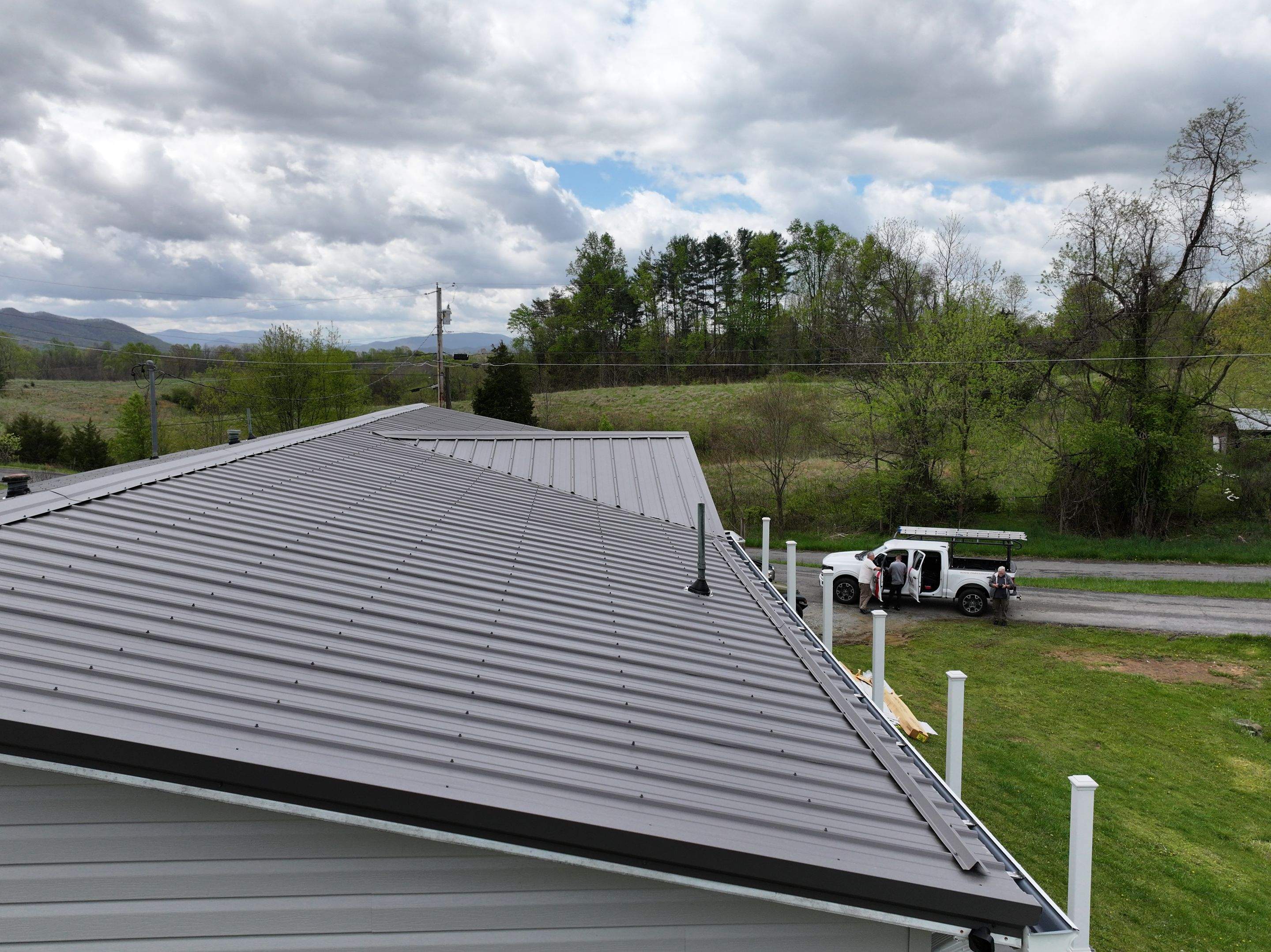 Charcoal Gray Textured Metal Roof by Omnia Roofing