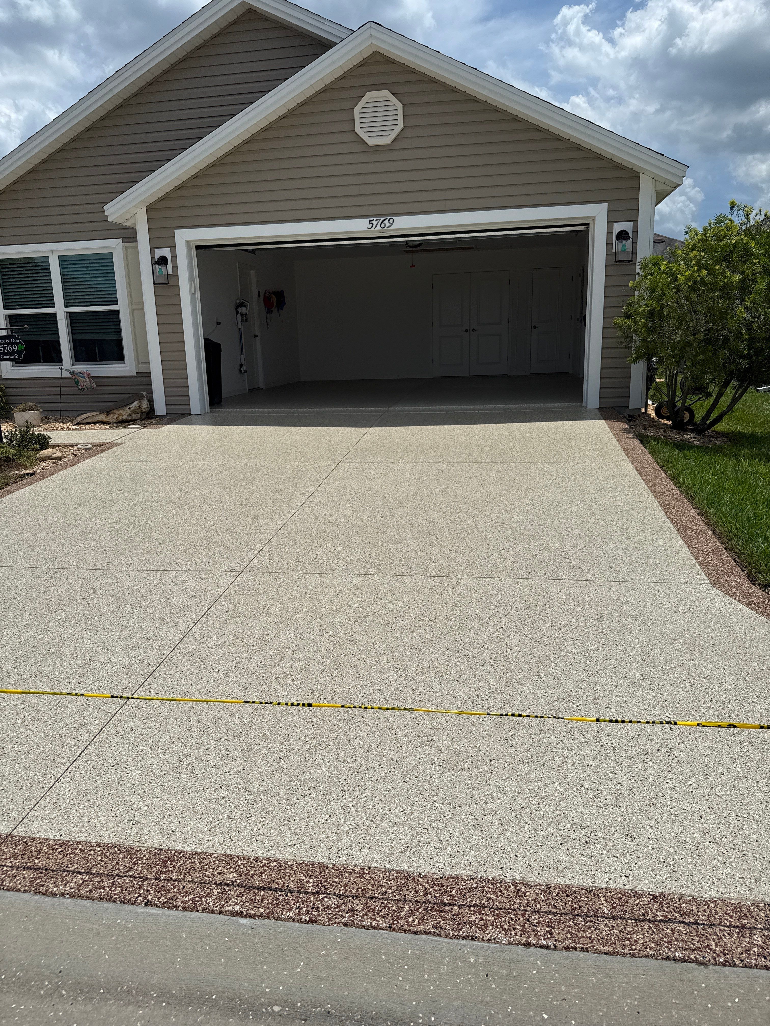 Driveway with Border by Innovative Concrete Coatings 