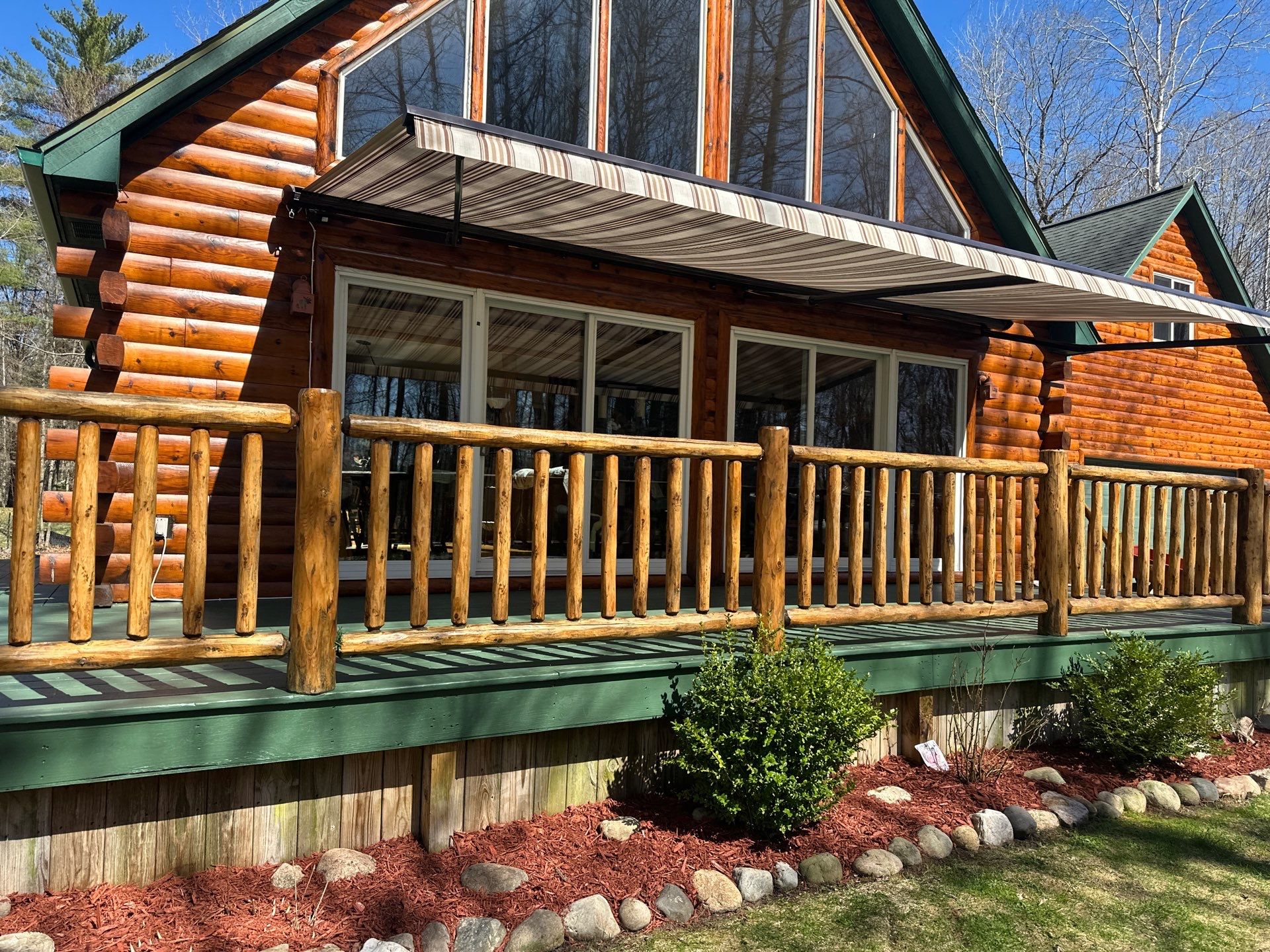 Retractable Awning Installation and Exterior Maintenance in Houghton Lake by Rainbow Seamless Systems