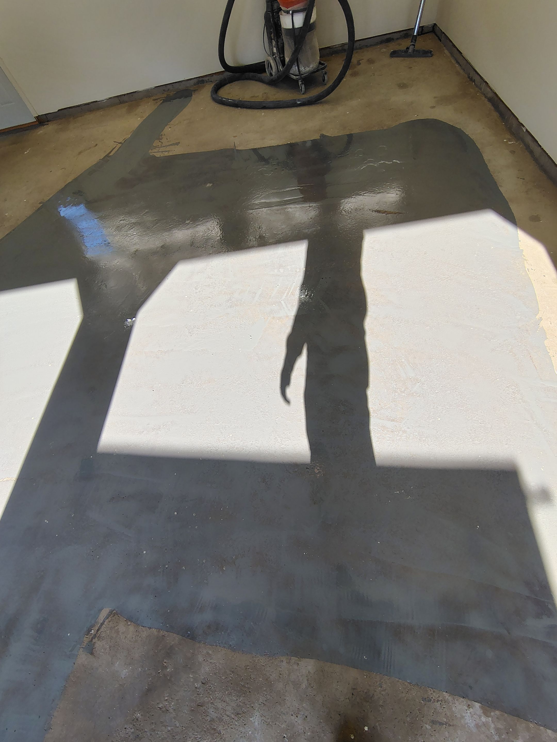 Full-Flake Epoxy Garage Floor Coating Installation in Sioux Falls by Select Painting, Coatings & Garage Cabinets