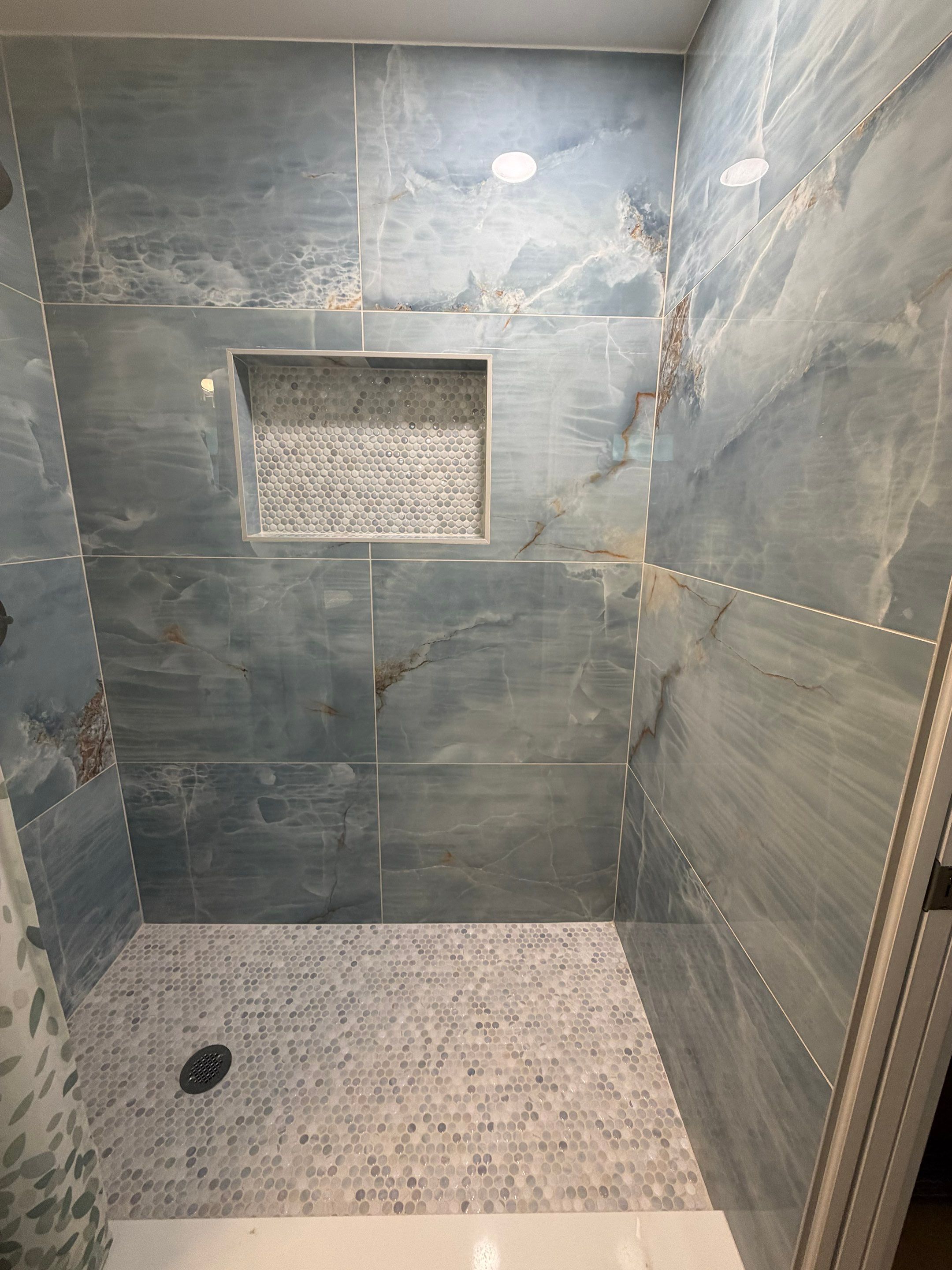 Elevated Bathroom Renovation featuring Oceanic Tile in Ormond Beach by Acies Renovations