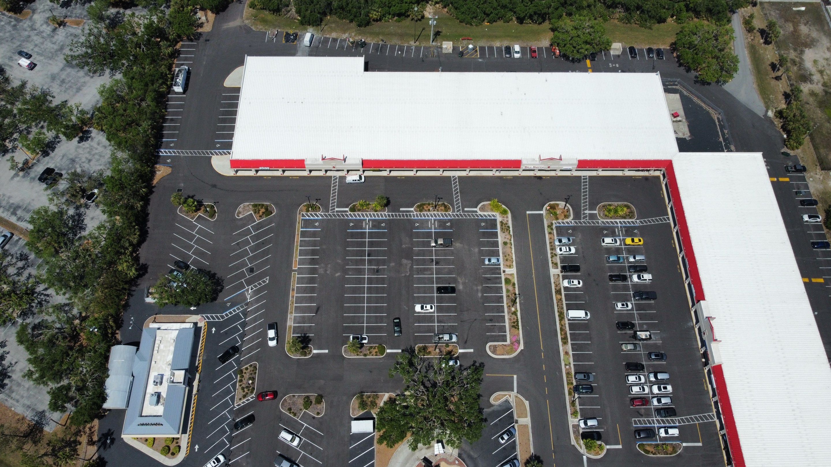 Commercial Metal Roof Replacement at Shopping Plaza in Port Charlotte by CES Roofing