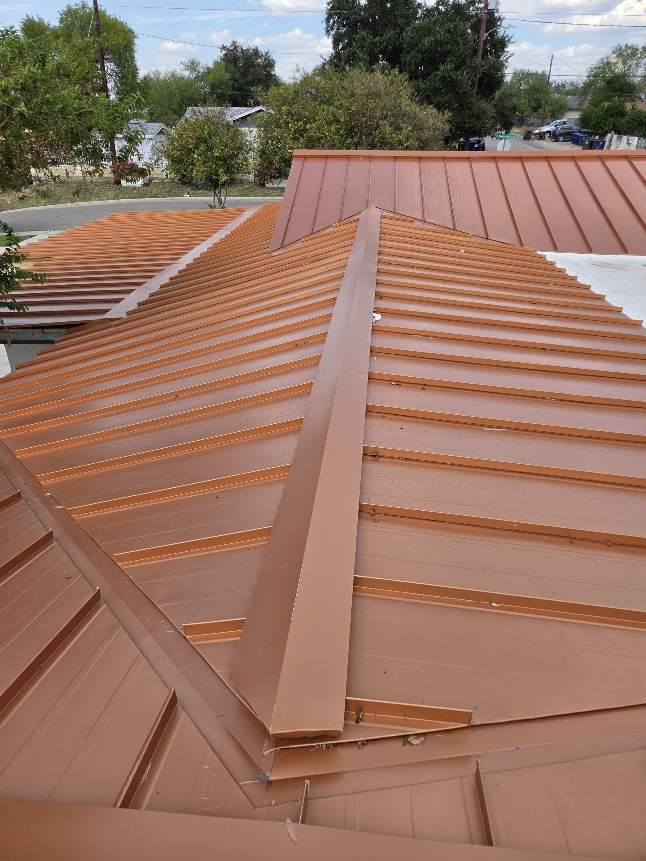Copper Standing Seam Metal Roof Installation for Laredo Medical Clinic by JM Flores Roofing & Construction, Inc