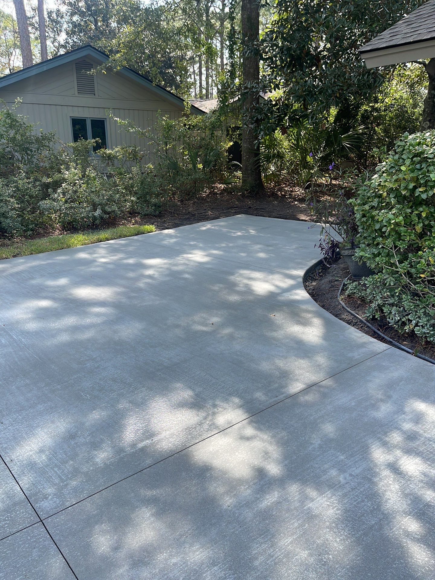 Concrete Driveway Replacement with Decorative Paver Inlay in Hilton Head Island by Lowcountry Scapes, LLC
