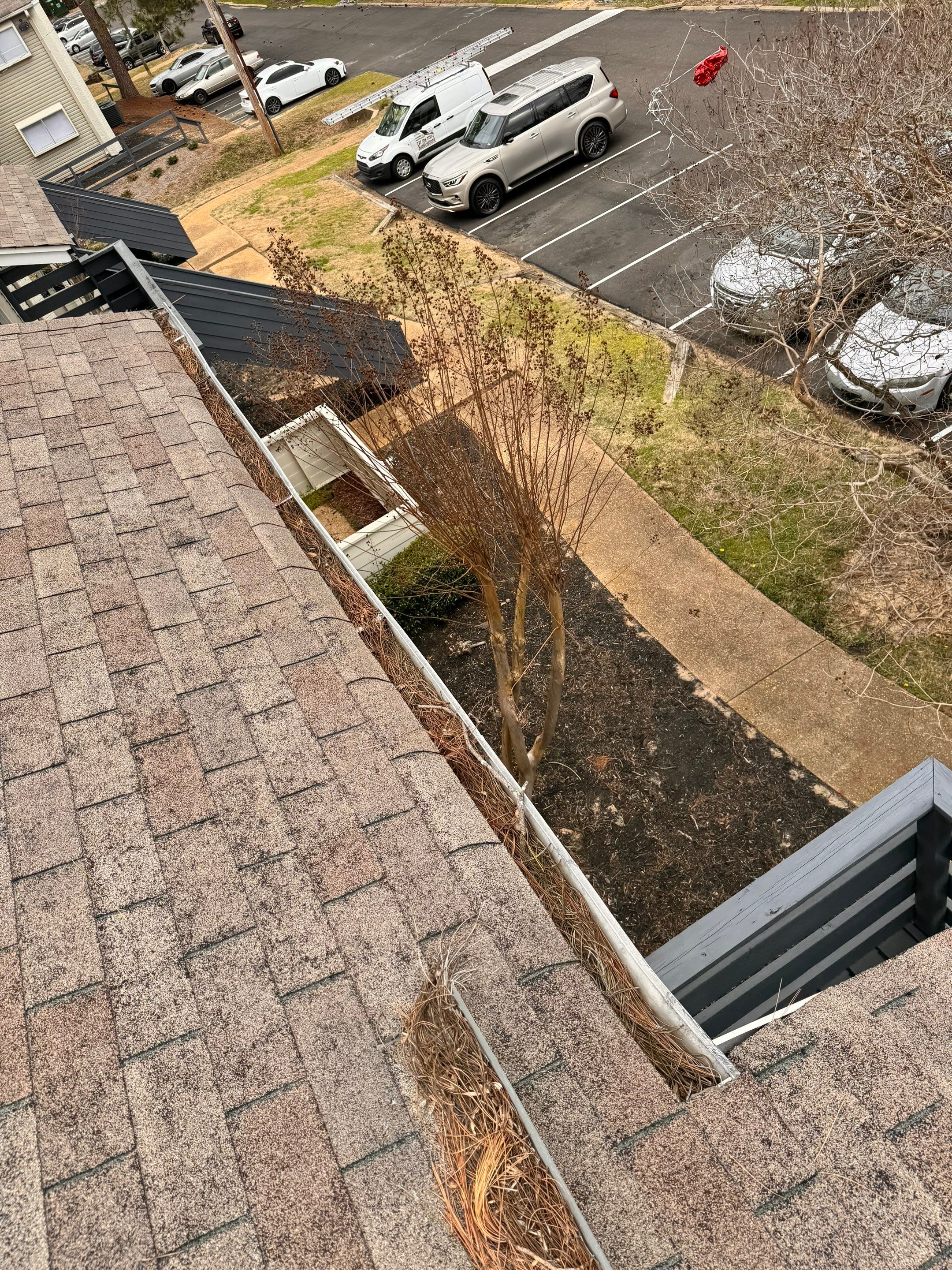 Commercial gutter cleaning Jackson before photo with filled gutters