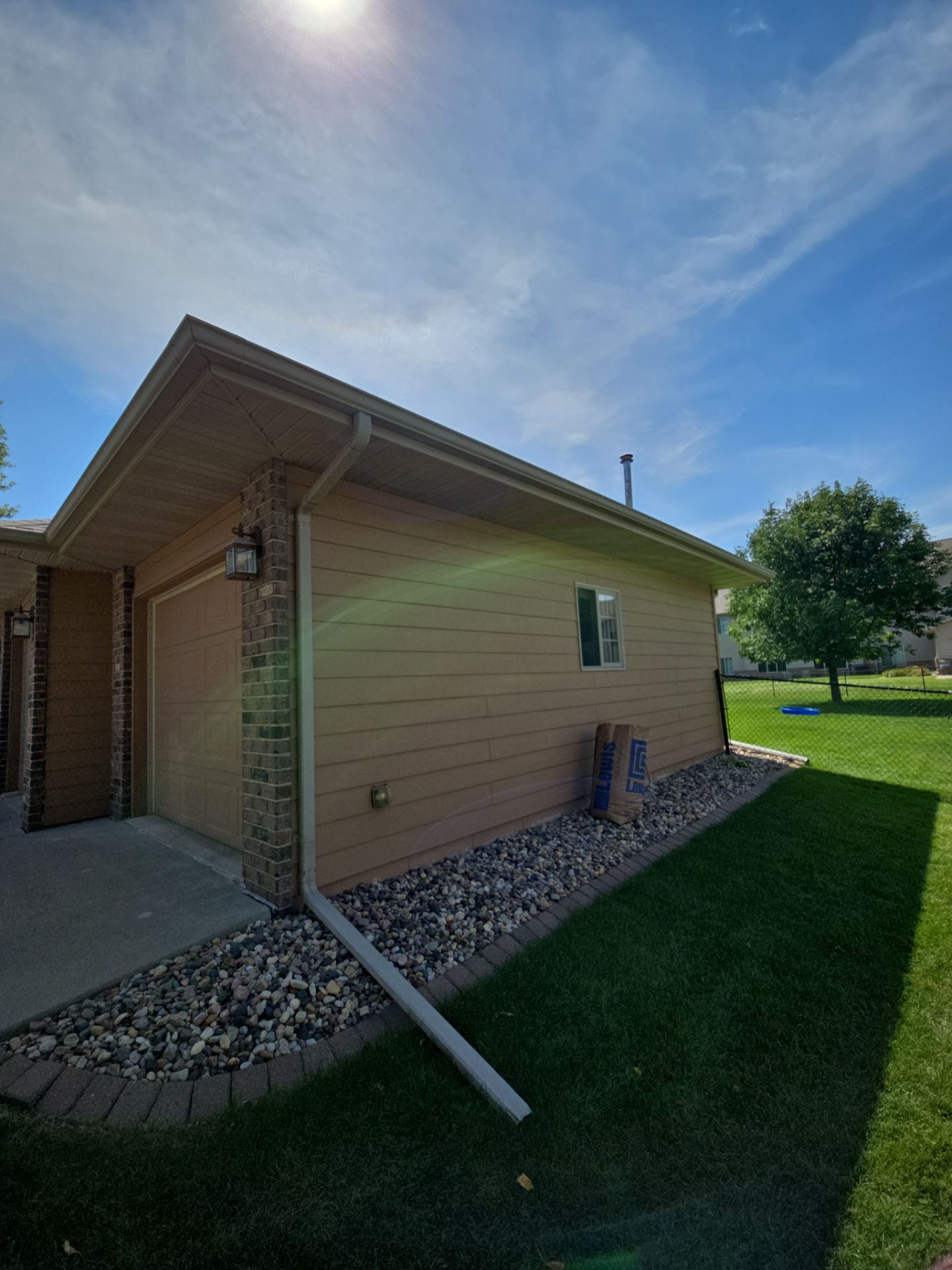 Sioux Falls Residential Exterior Door and Siding Refresh by Select Painting, Coatings & Garage Cabinets