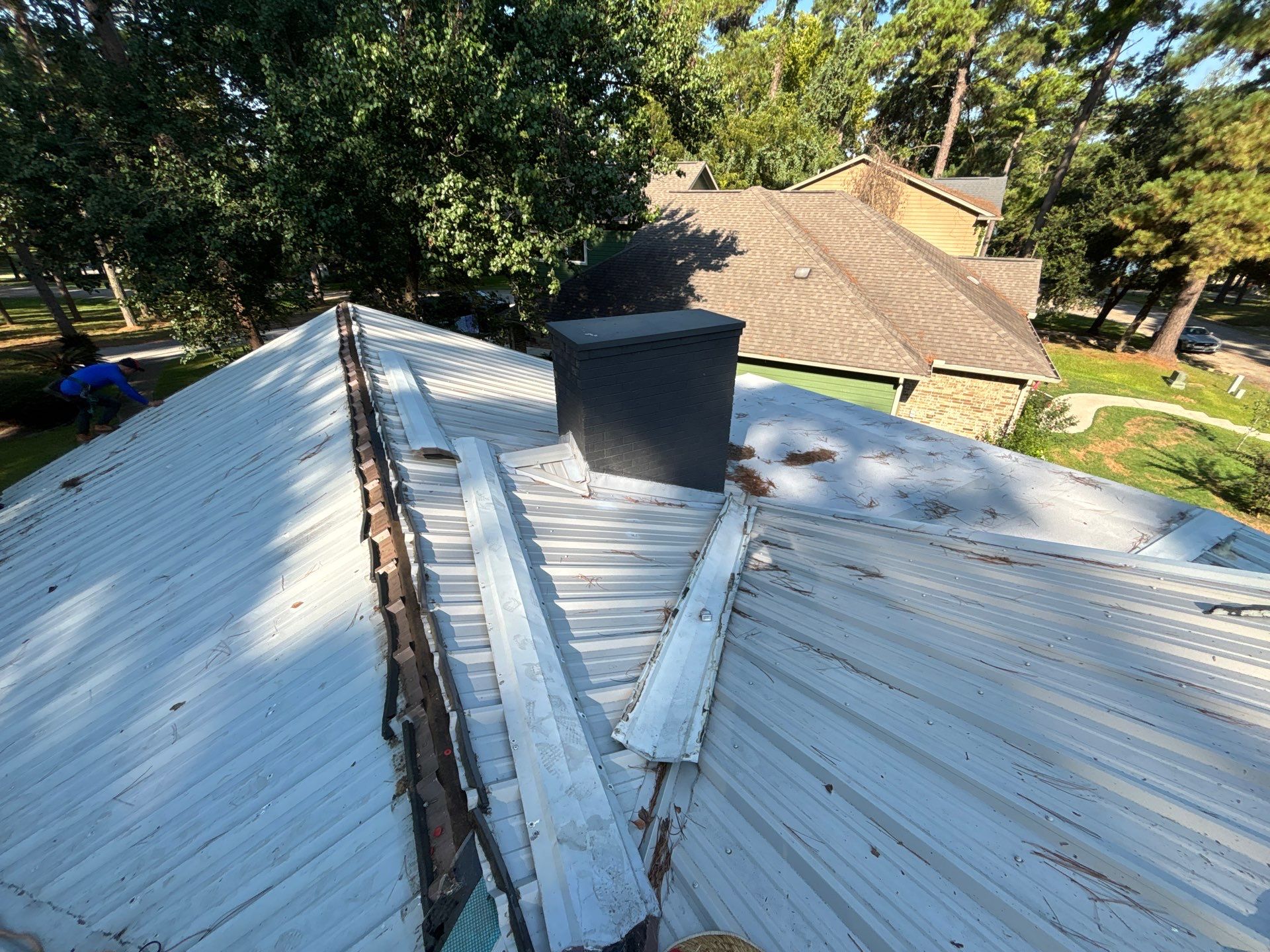 White Standing Seam Metal Roof Replacement in Willis, Texas by Abbott Roofing Company