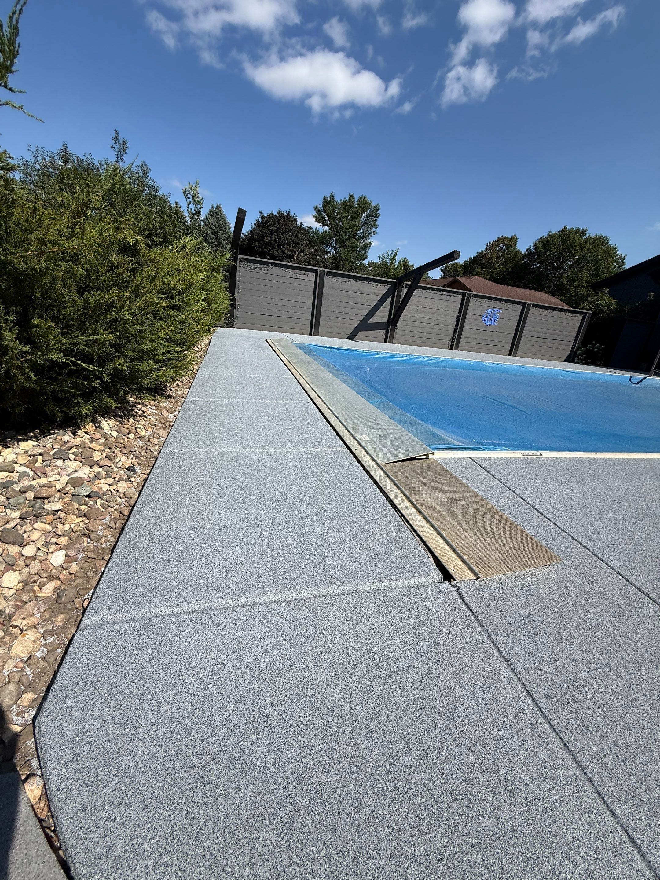 Garage Floor and Textured Pool Deck Coating in Sioux Falls by Select Painting, Coatings & Garage Cabinets
